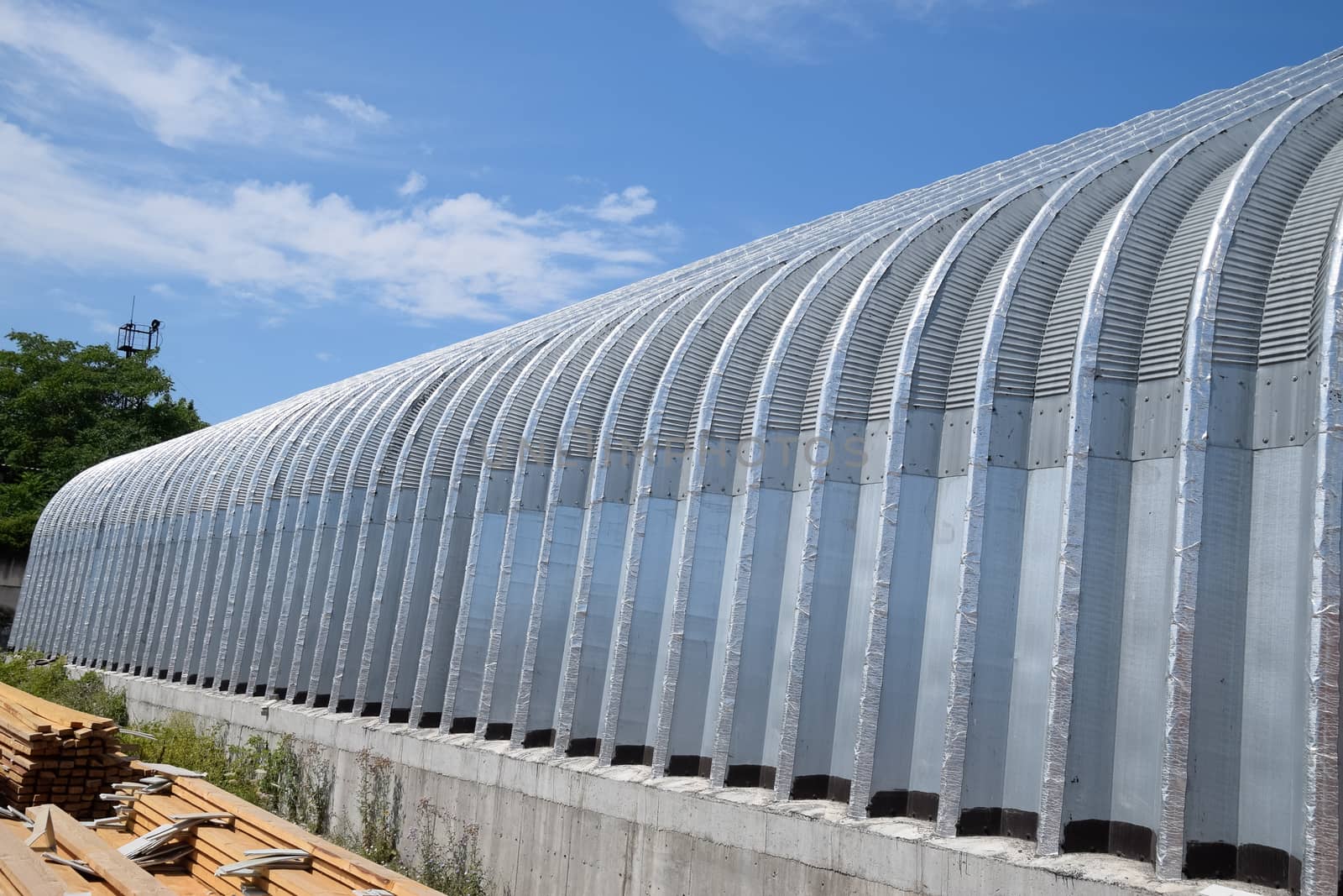 corrugated galvanized iron hangar. a Construction base.