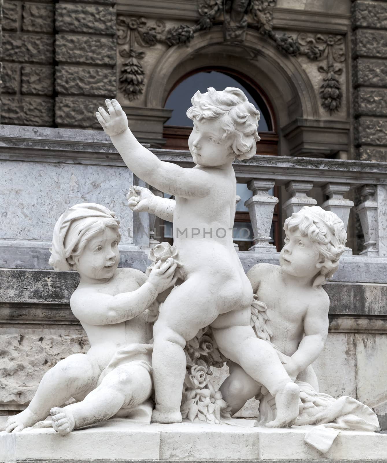 Playing children statue in Vienna by Goodday