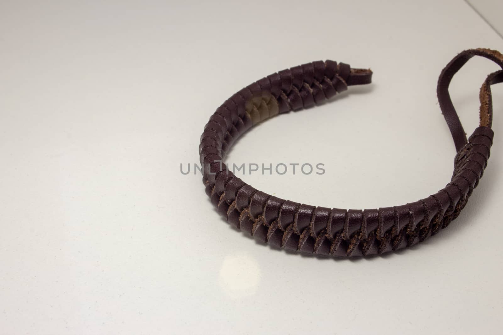 Leather bracelet, braided in a beautiful pattern, with straps to fasten on the wrist