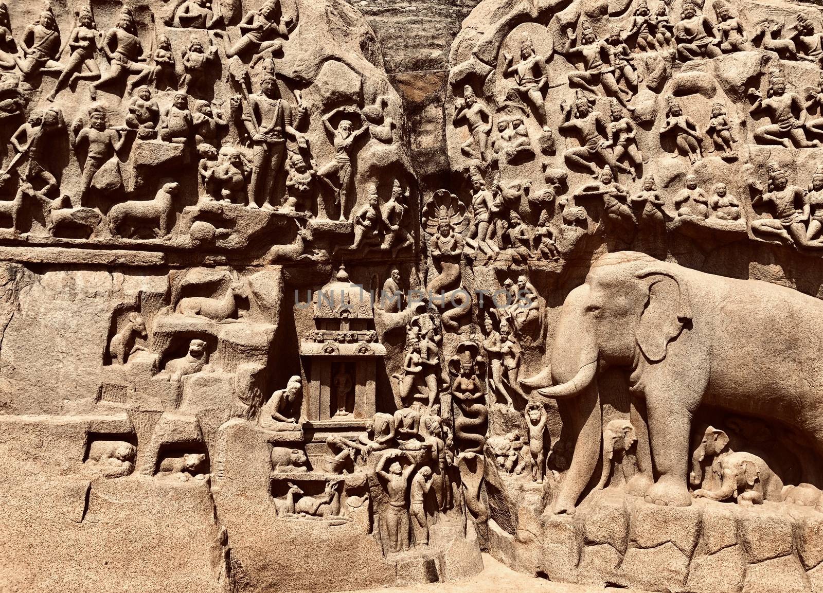 Descent of the Ganges is one of the Group of Monuments at Mahabalipuram and it is a UNESCO World Heritage Site. It is a giant open-air rock cut bas relief sculptures carved on two monolithic rocks. The story depicted in the relief is the descent of the sacred river Ganges to earth from the heavens. The relief was created by Narasimhavarman-1 to celebrate the victory over Chalukiya king. There are 146 sculptures of animals, God, people and half-humans carved in the rock relief.
