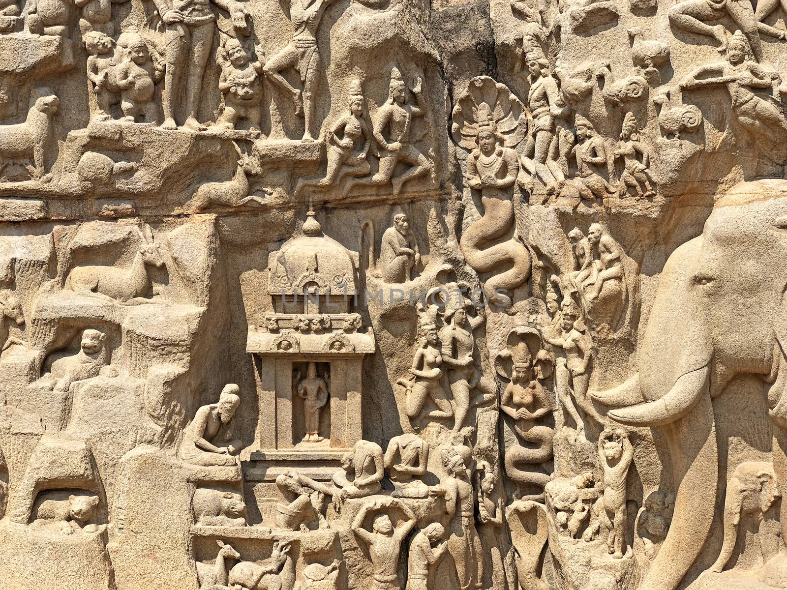 Descent of the Ganges is one of the Group of Monuments at Mahabalipuram and it is a UNESCO World Heritage Site. It is a giant open-air rock cut bas relief sculptures carved on two monolithic rocks. The story depicted in the relief is the descent of the sacred river Ganges to earth from the heavens. The relief was created by Narasimhavarman-1 to celebrate the victory over Chalukiya king. There are 146 sculptures of animals, God, people and half-humans carved in the rock relief.