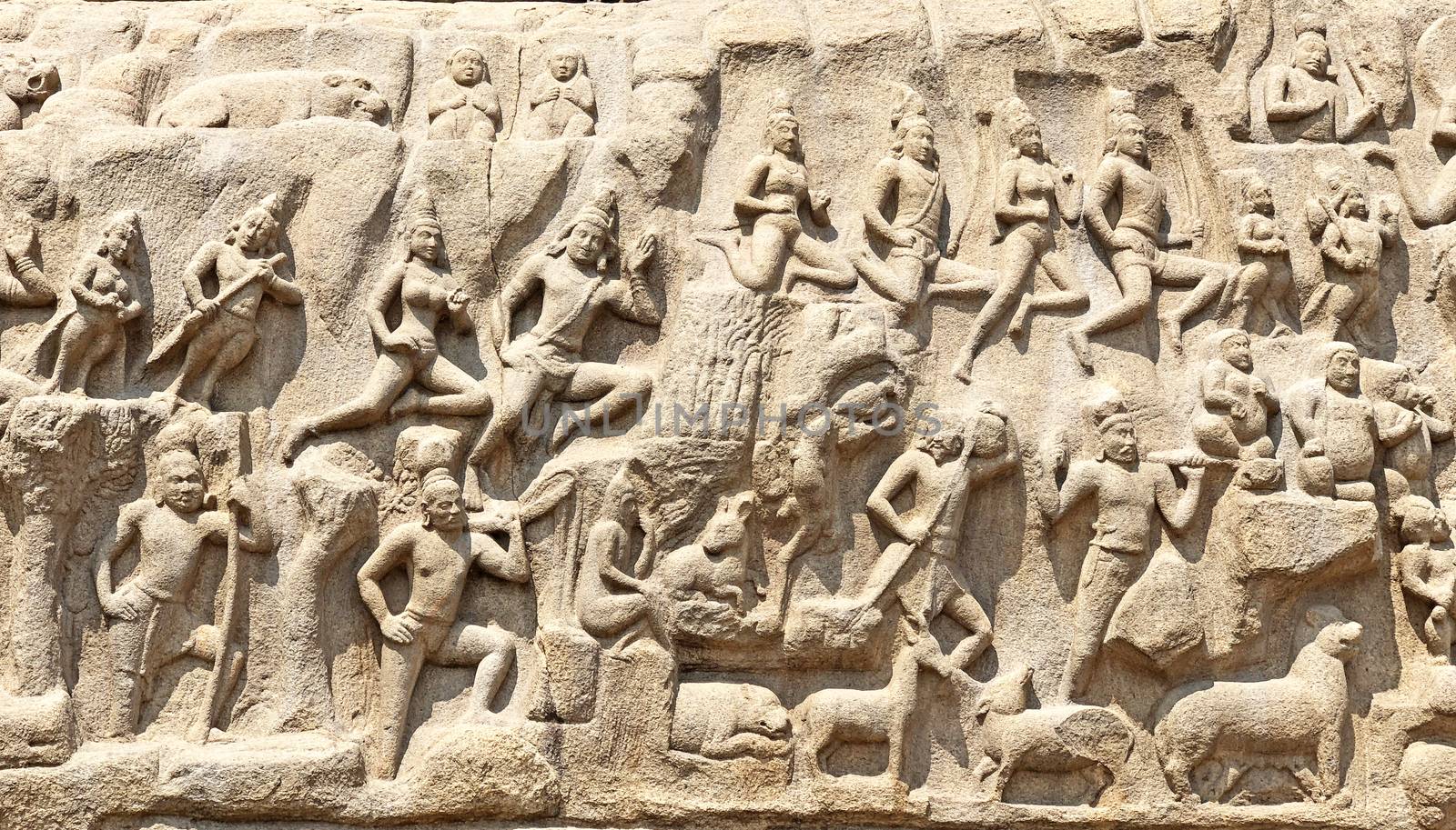 Descent of the Ganges is one of the Group of Monuments at Mahabalipuram and it is a UNESCO World Heritage Site. It is a giant open-air rock cut bas relief sculptures carved on two monolithic rocks. The story depicted in the relief is the descent of the sacred river Ganges to earth from the heavens. The relief was created by Narasimhavarman-1 to celebrate the victory over Chalukiya king. There are 146 sculptures of animals, God, people and half-humans carved in the rock relief.