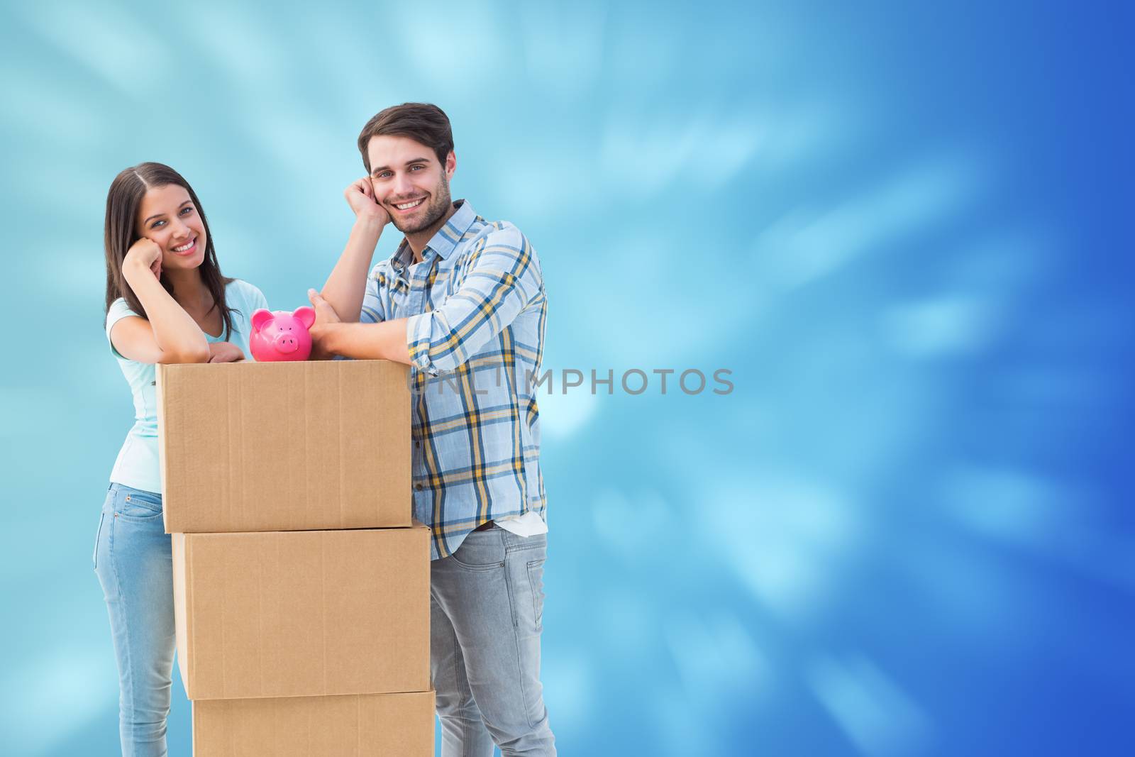 Happy young couple with moving boxes and piggy bank against valentines heart design