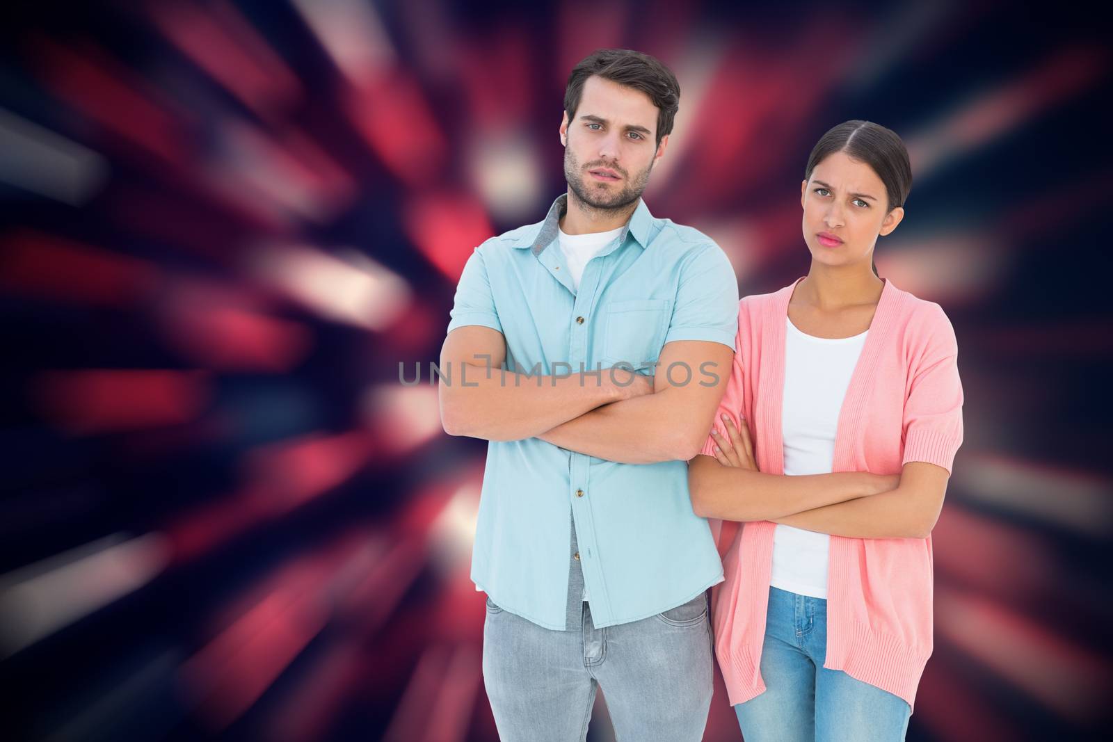 Composite image of serious couple with arms crossed by Wavebreakmedia