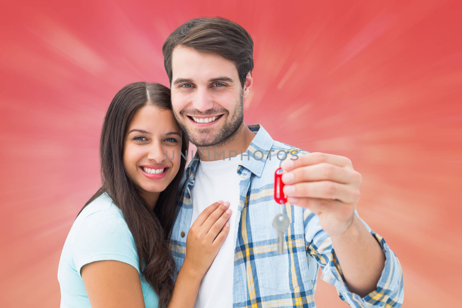 Composite image of happy young couple holding new house key by Wavebreakmedia