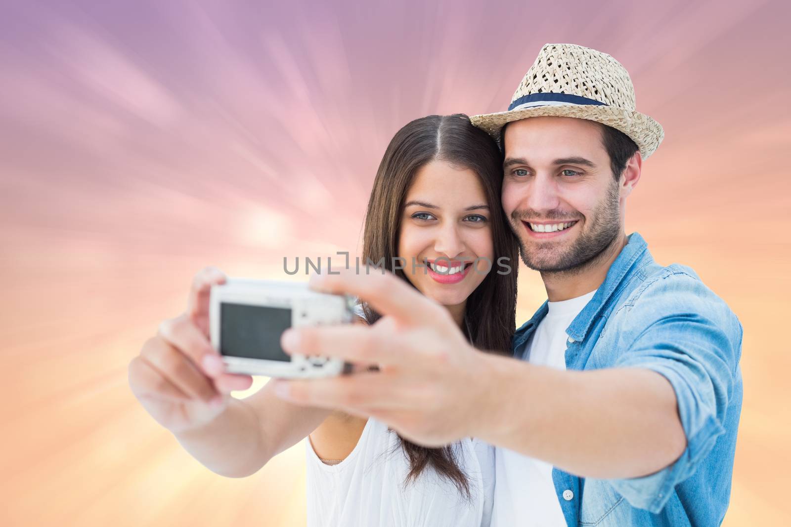 Composite image of happy hipster couple taking a selfie by Wavebreakmedia