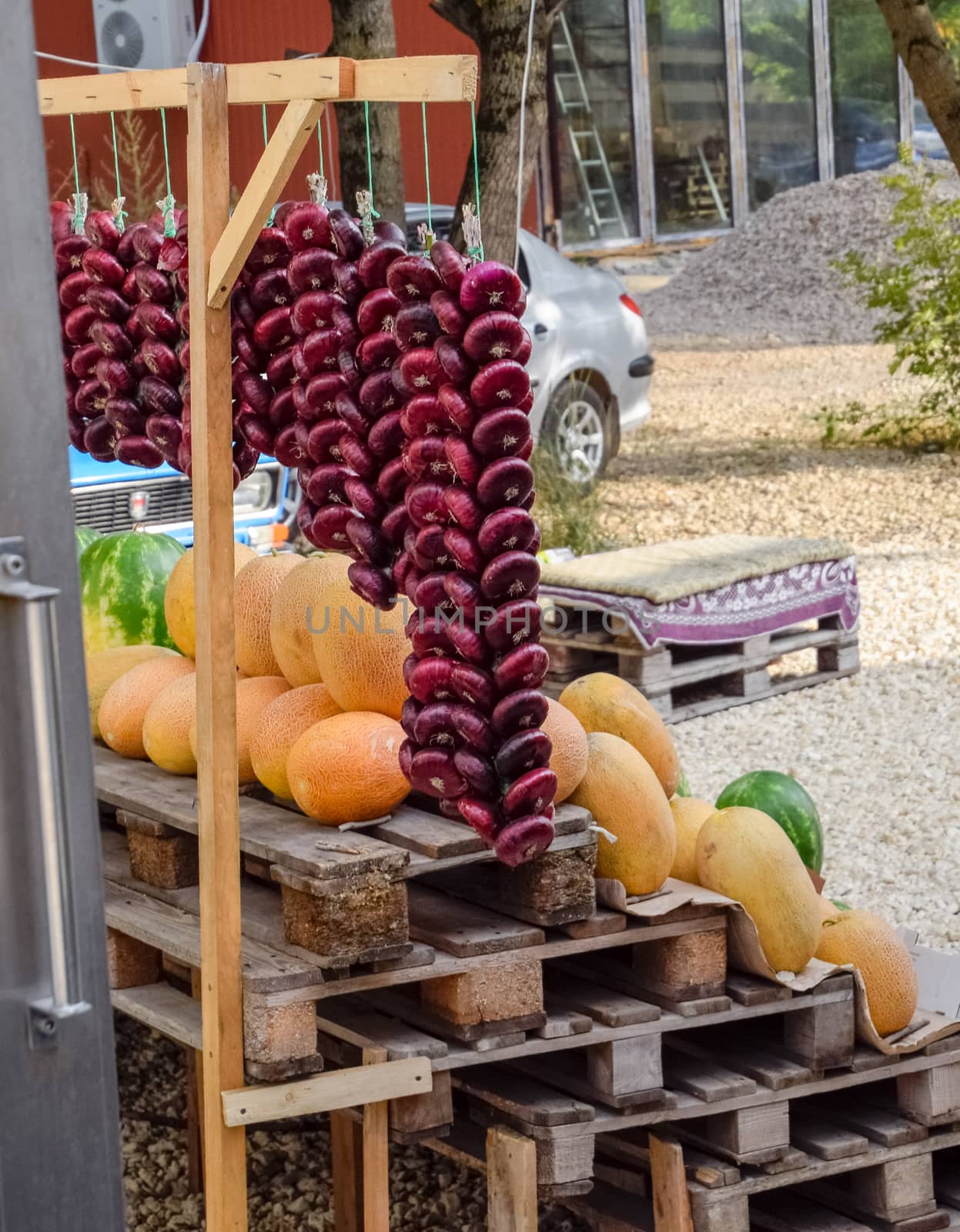 Selling vegetables and watermelons by road. Resort shops by the road for tourists. by fedoseevaolga