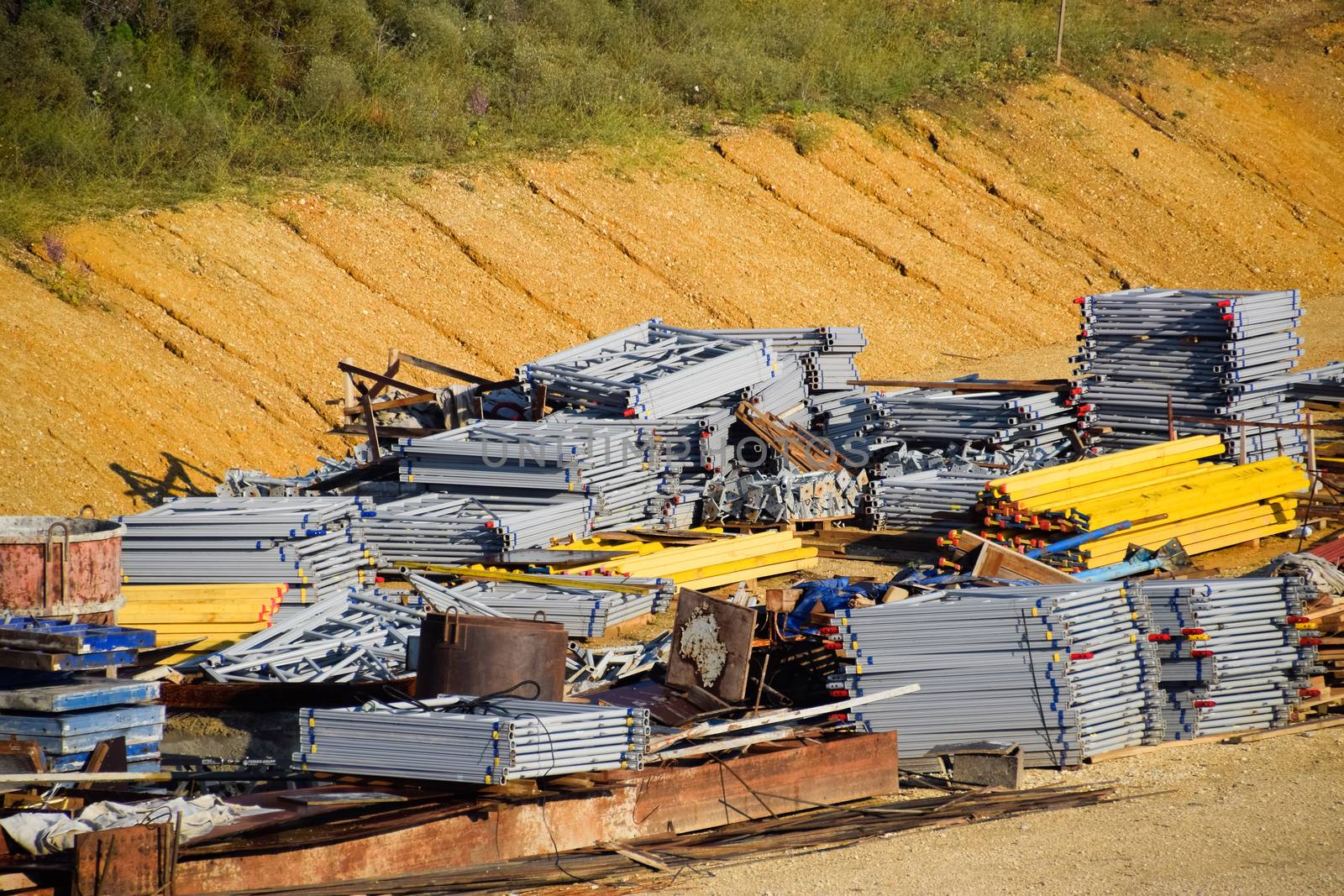 Warehouse of building materials. a Building base, metal, wood and blocks with bricks.