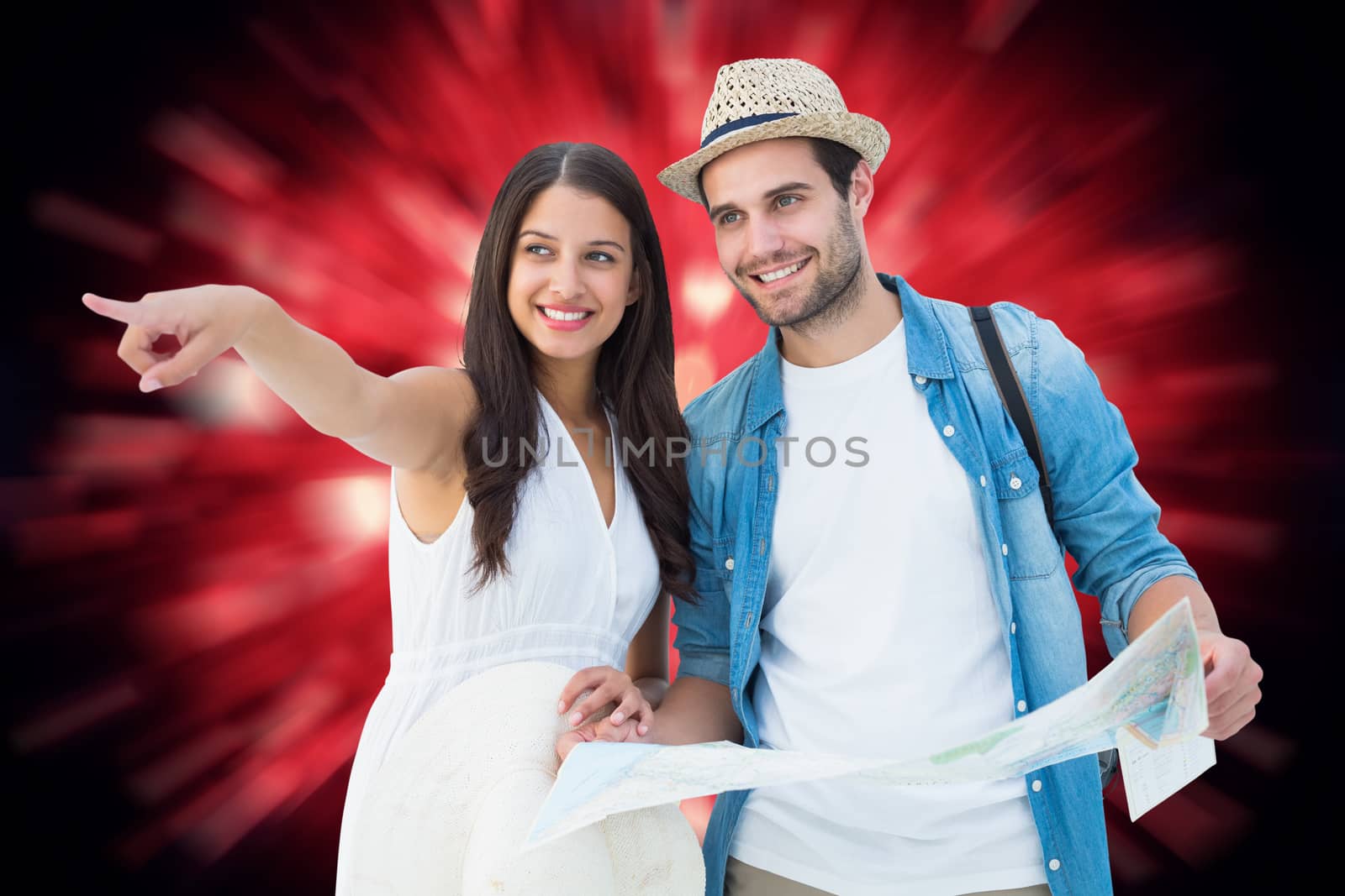 Happy hipster couple looking at map against valentines heart design