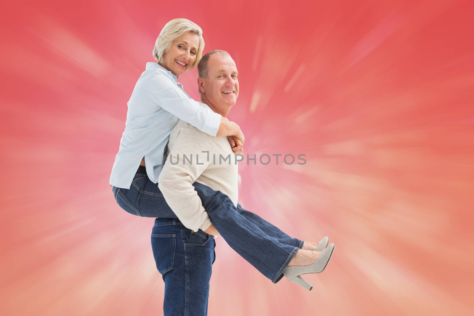 Composite image of happy mature couple having fun by Wavebreakmedia