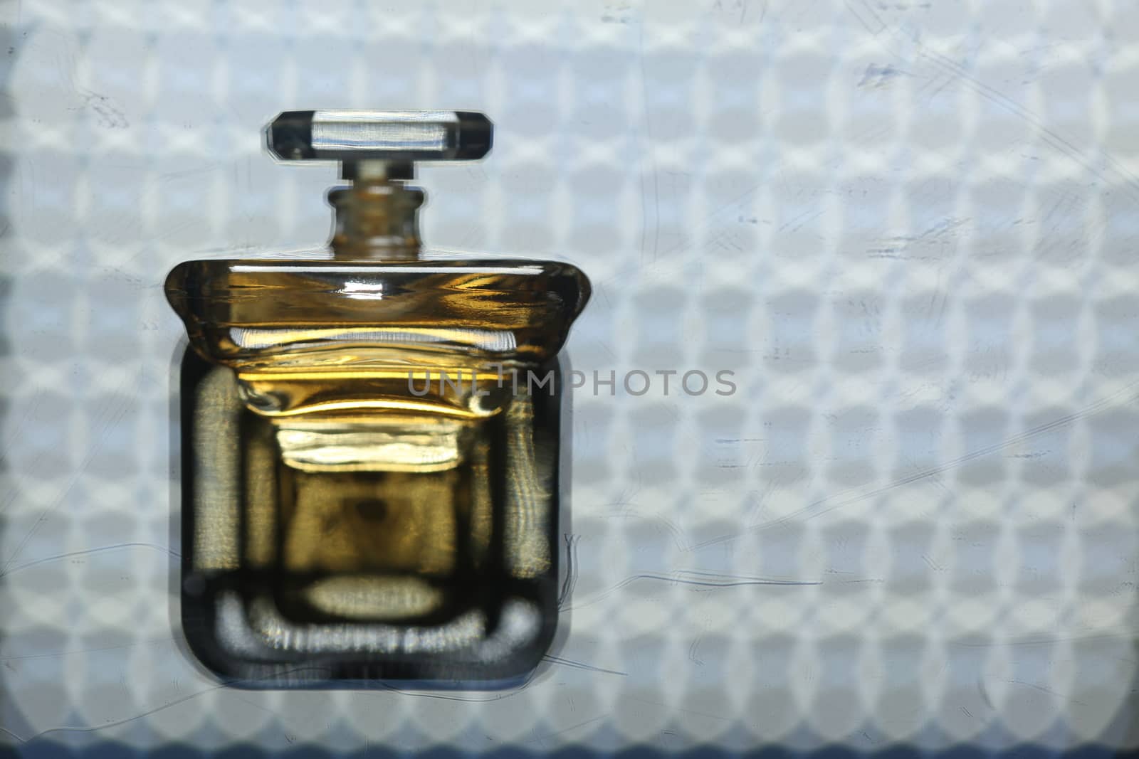 Perfume bottle with golden cap