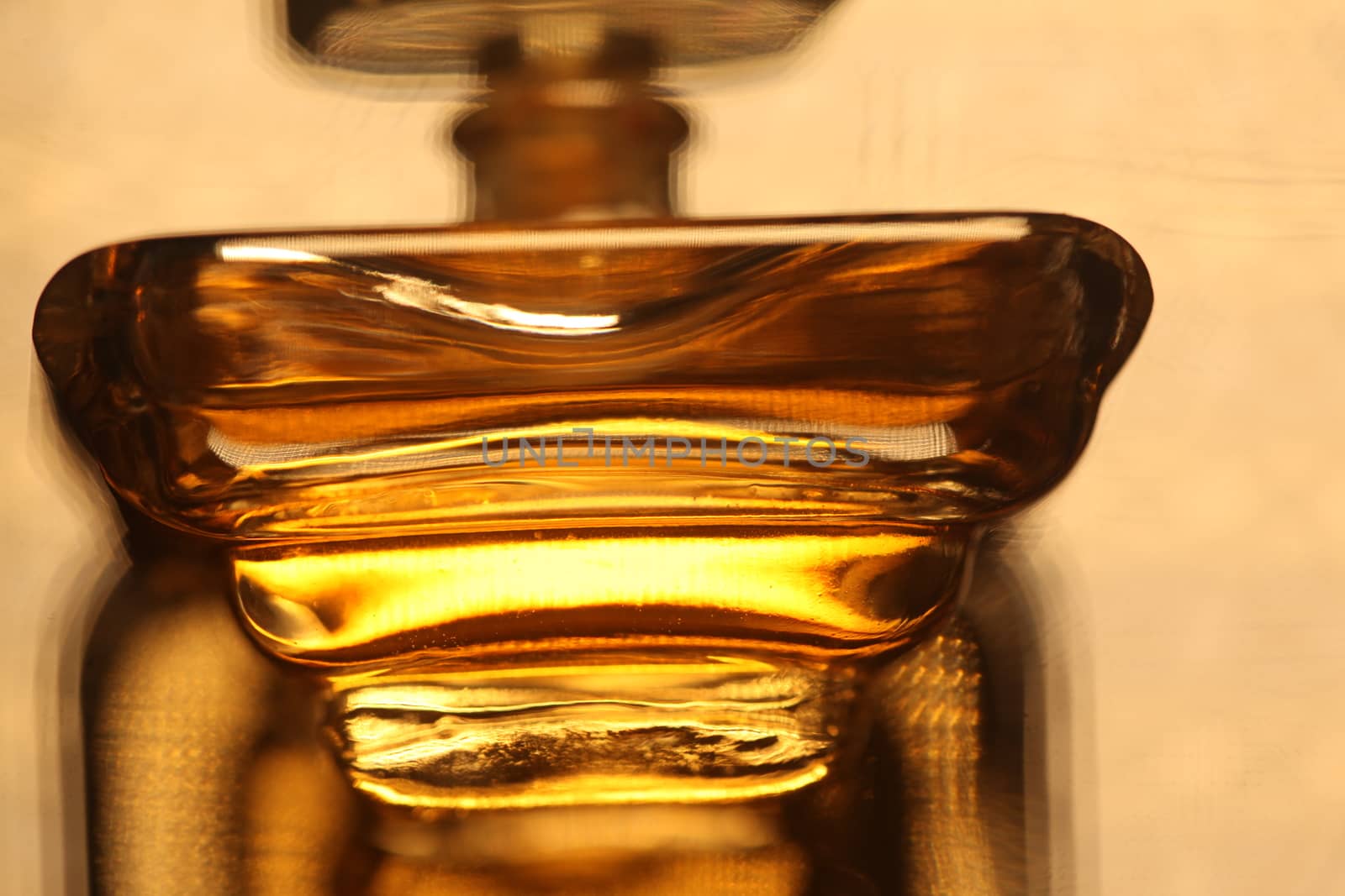 Perfume bottle with golden cap