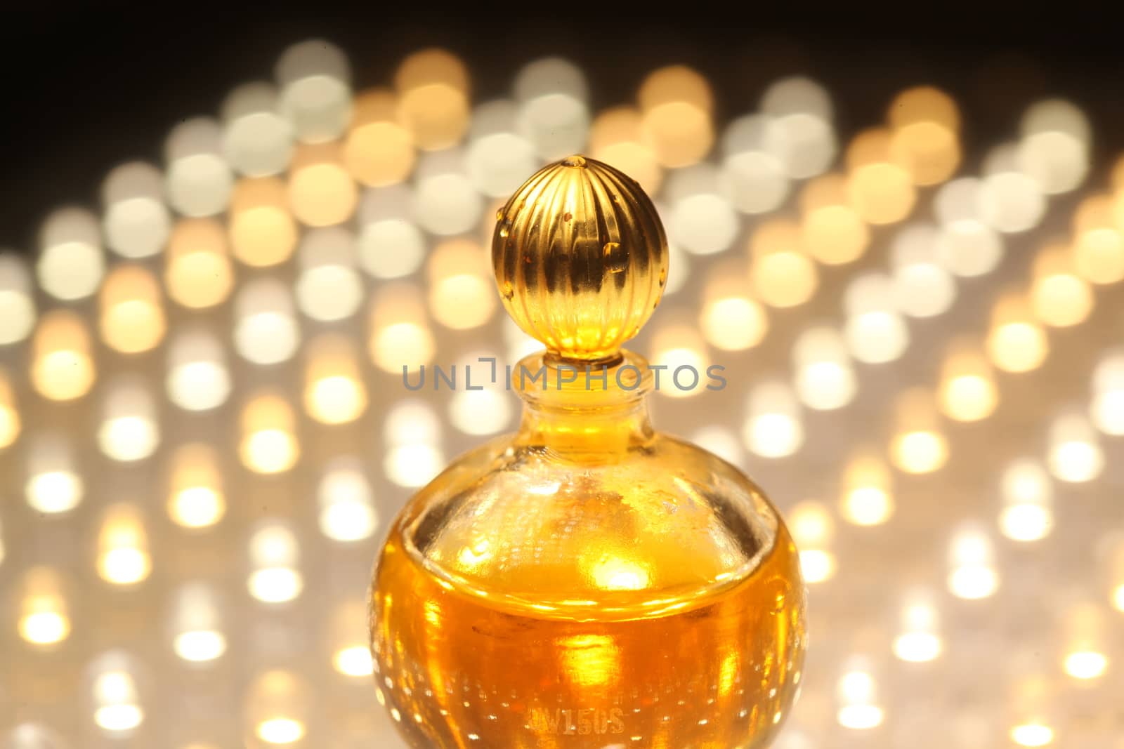 Perfume bottle with golden cap