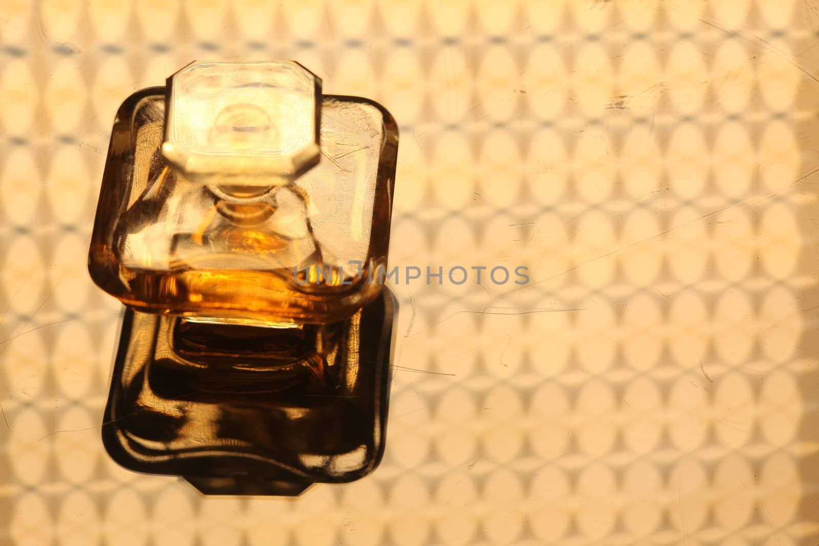 Perfume bottle with golden cap