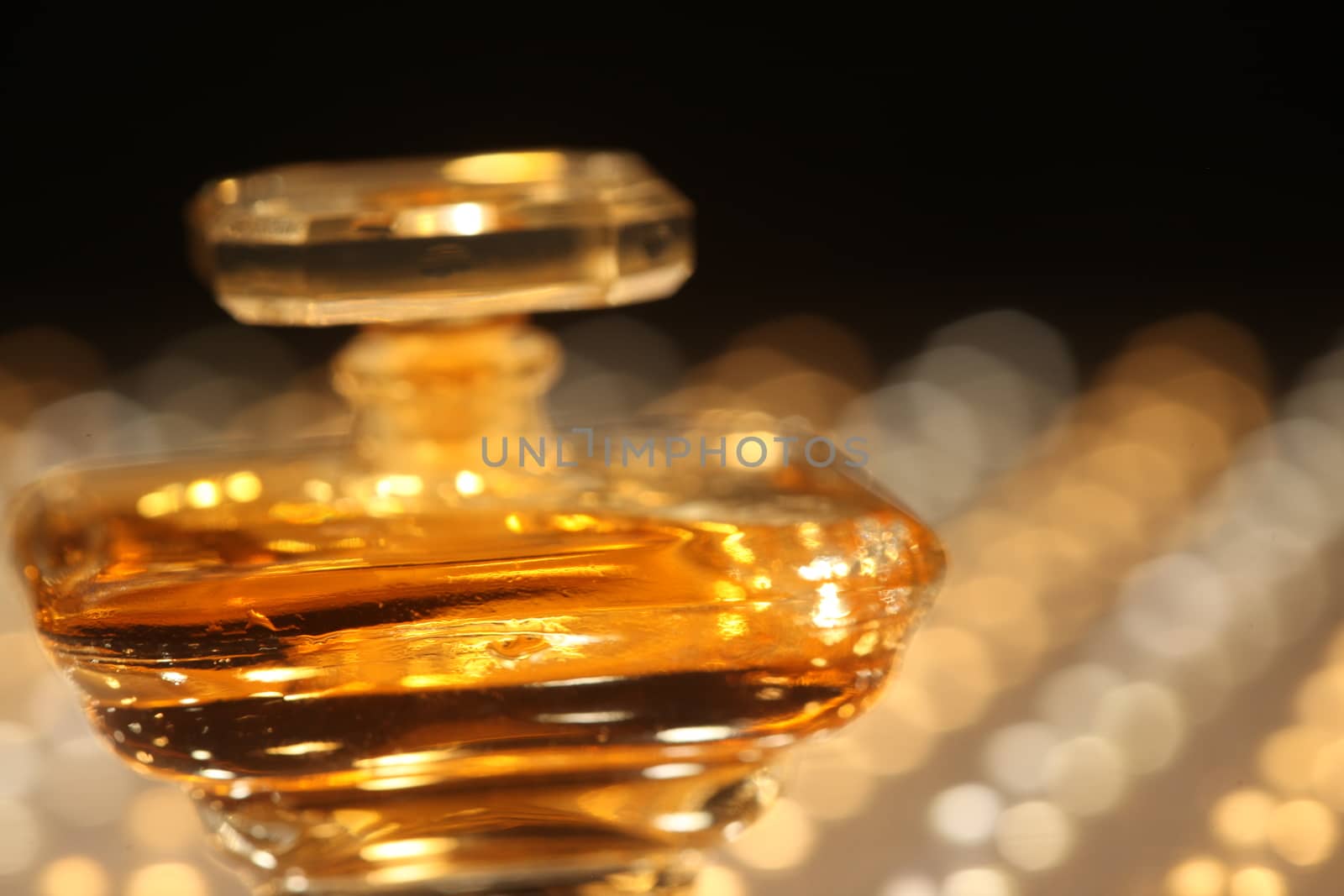 Perfume bottle with golden cap