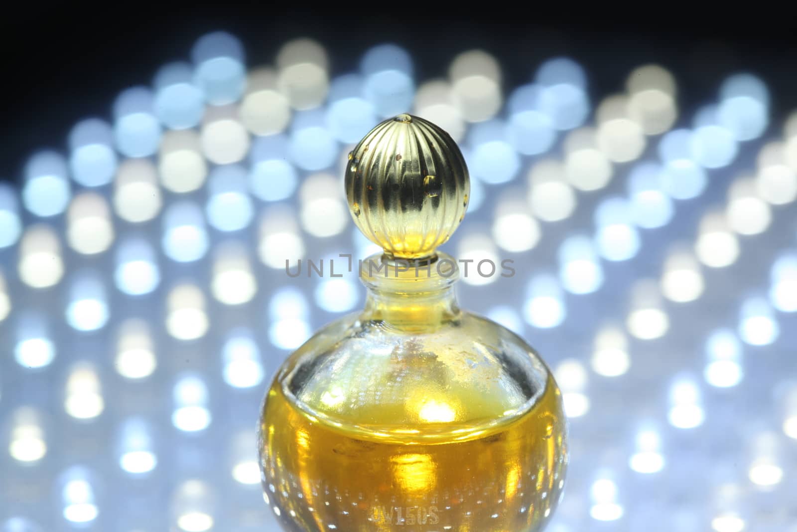 Perfume bottle with golden cap by rajastills