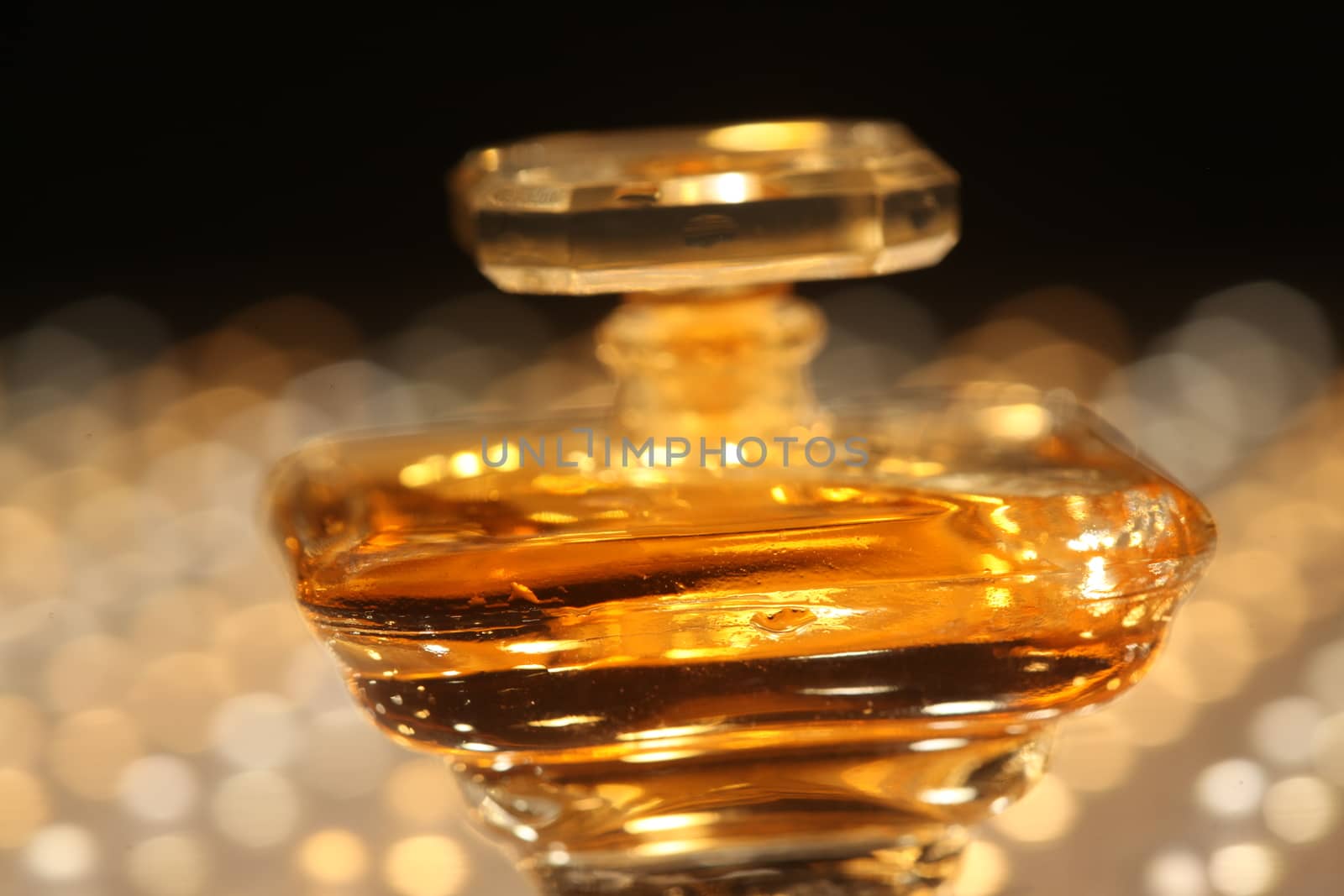 Perfume bottle with golden cap by rajastills