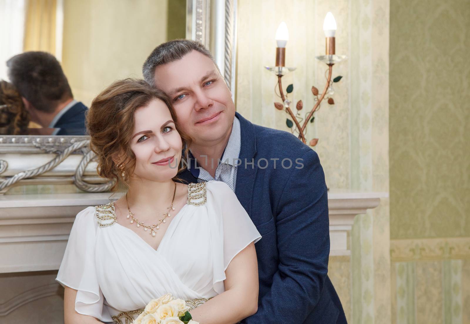 couple of lovers standing in the hall of prefecture at marriage