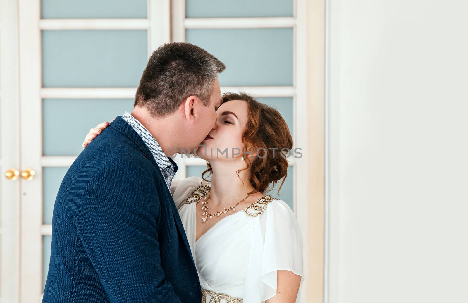 couple of lovers kissing in prefecture at marriage closeup