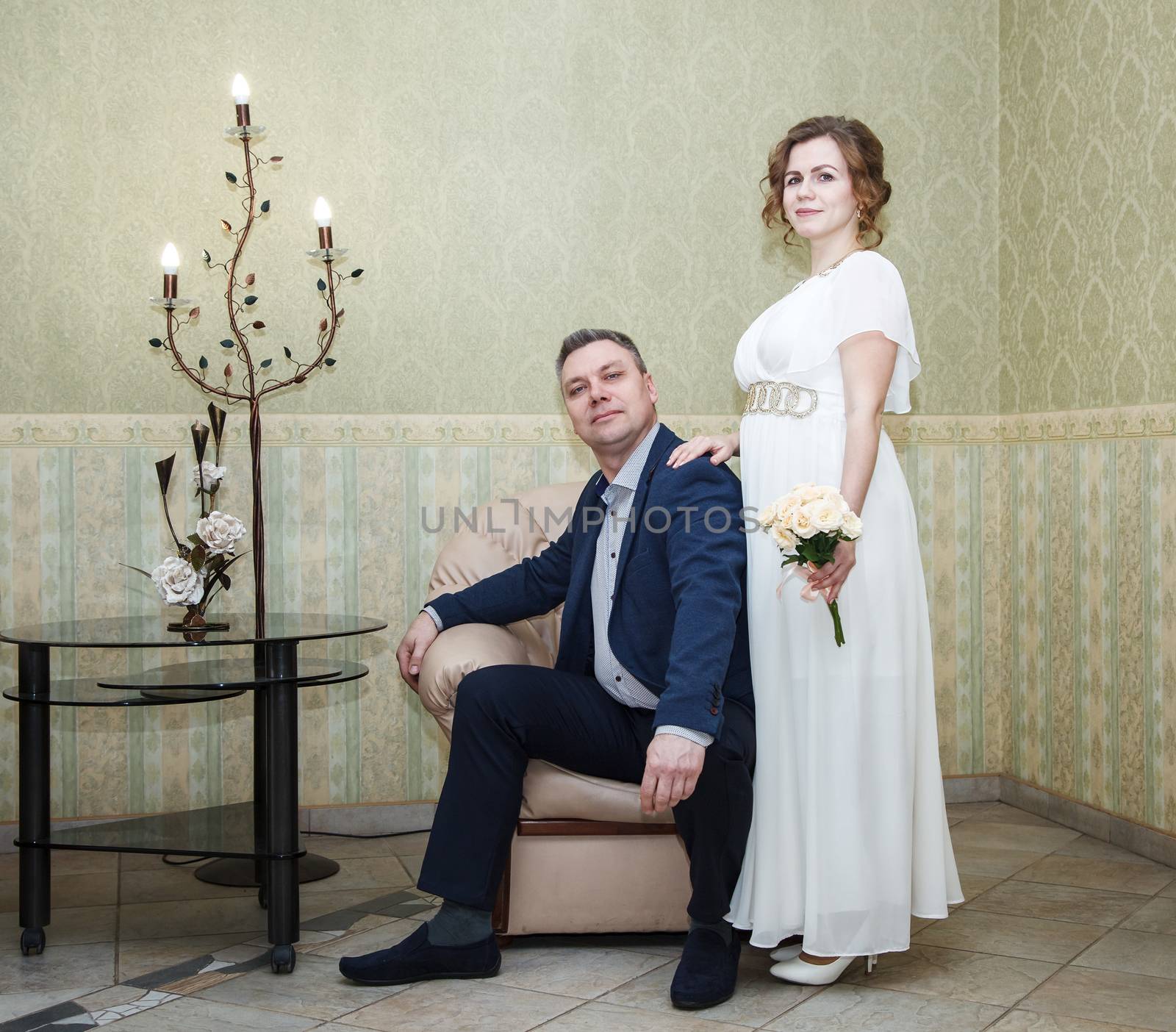 couple of lovers posing in the hall of prefecture at marriage