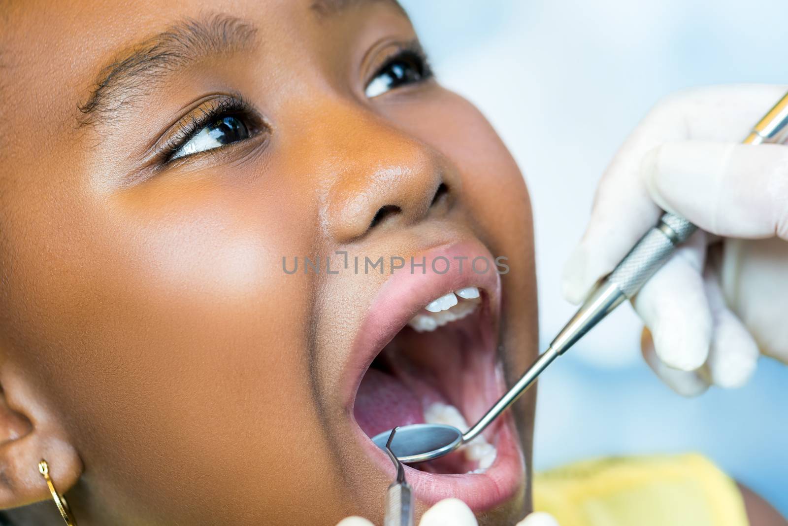 African youngster at dental checkup. by karelnoppe