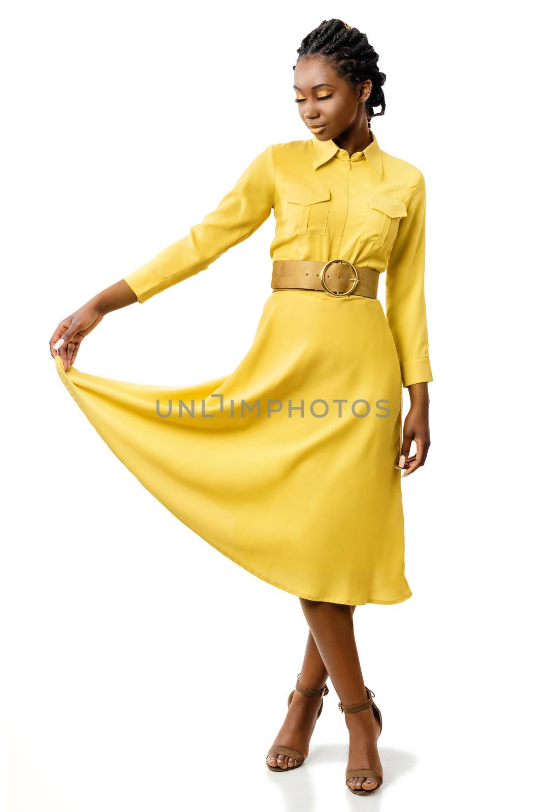 Attractive black girl in stylish yellow dress. by karelnoppe