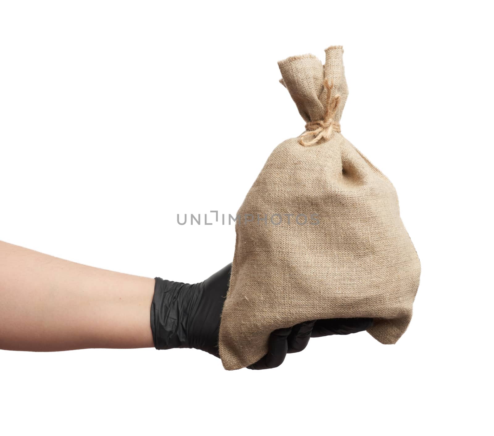 male hand in black latex glove holds a full canvas bag on a white background, close up