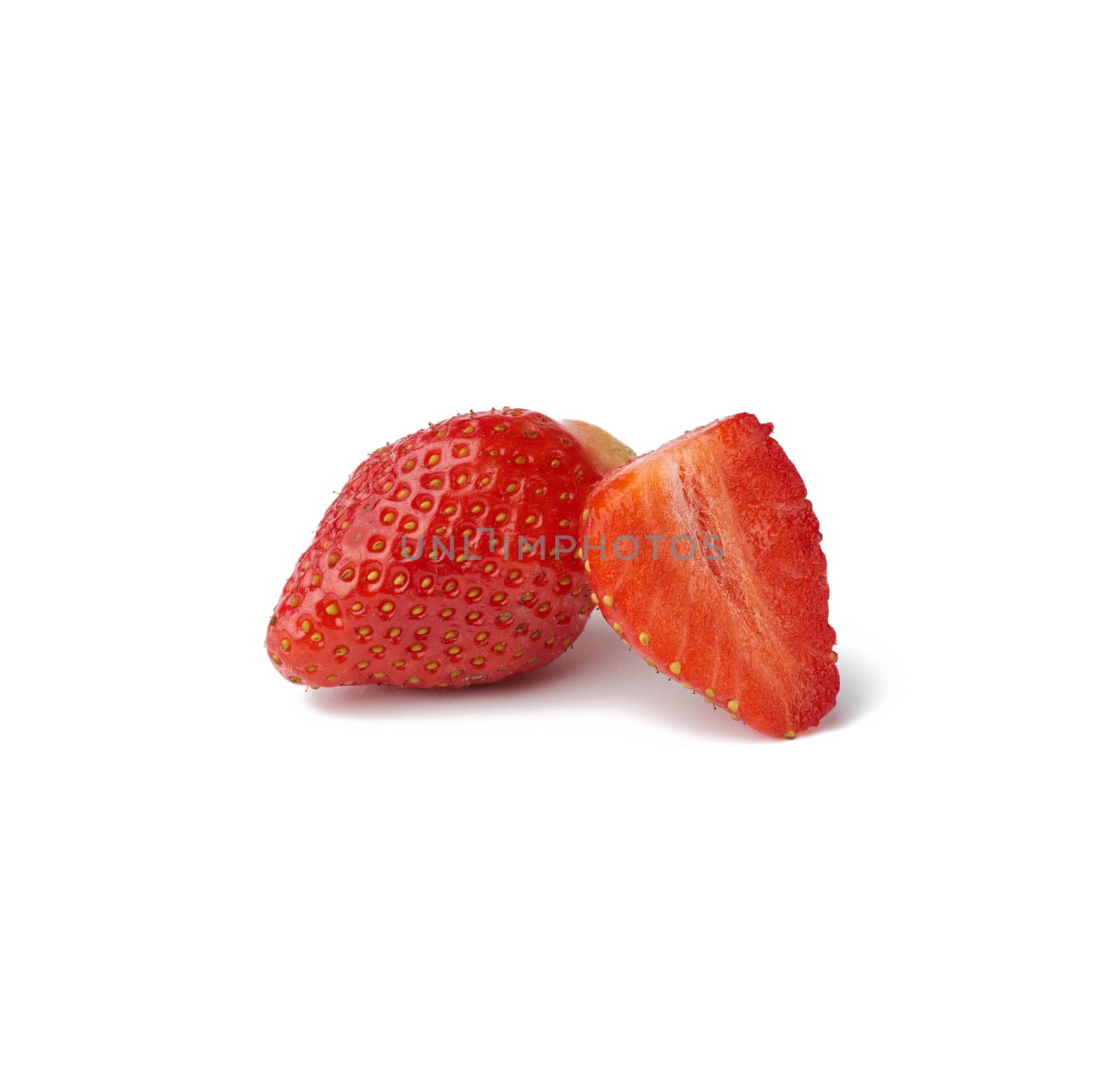 whole and half ripe red strawberries isolated on a white backgro by ndanko