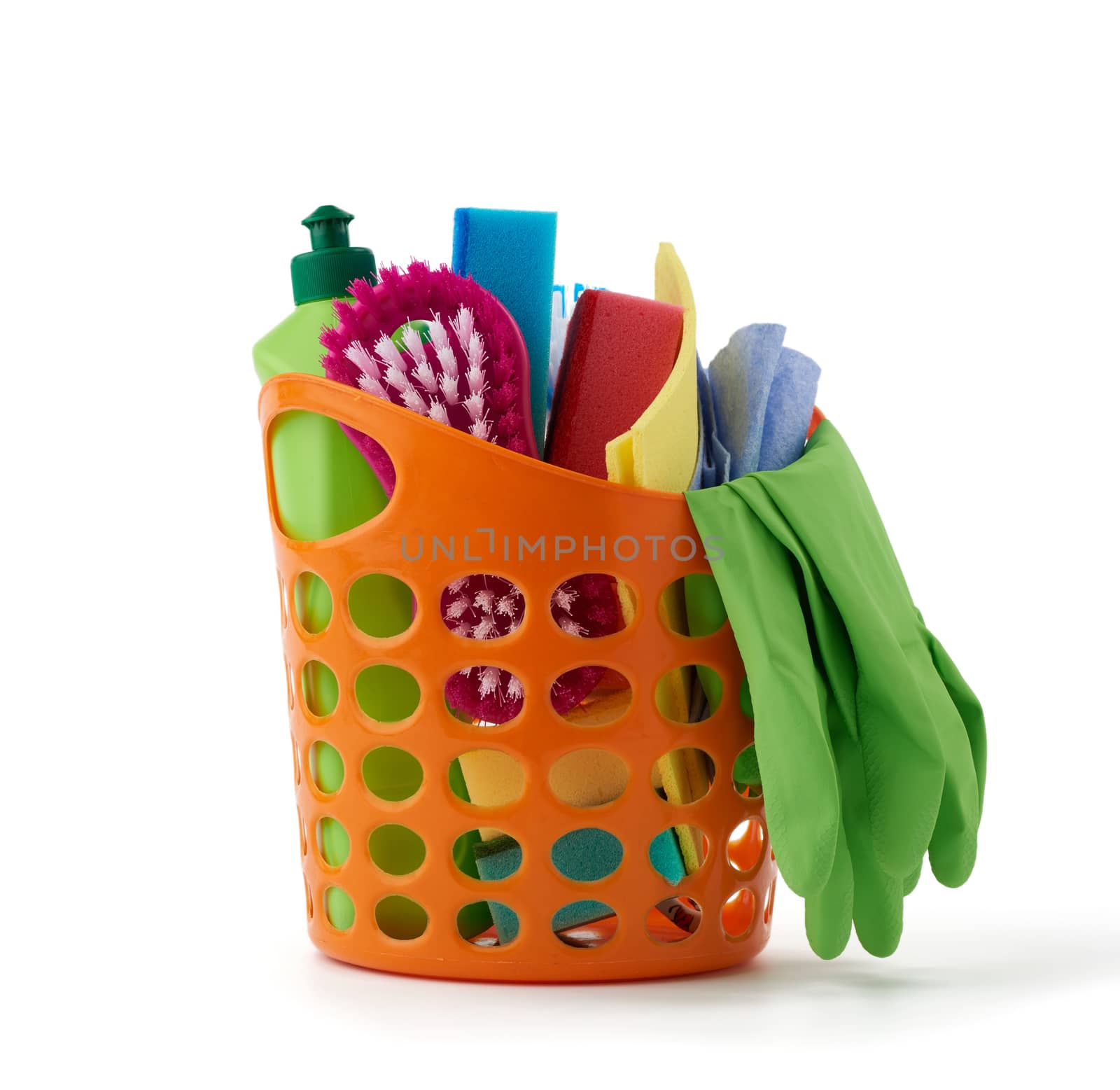 orange basket with washing sponges, rubber protective gloves, brushes and cleaning agent in a green plastic bottle, set isolated on a white background