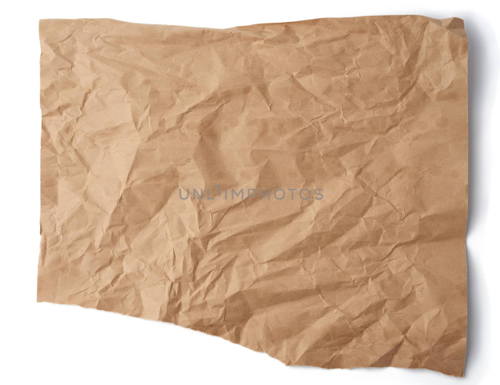 piece of crumpled brown paper isolated on white background by ndanko
