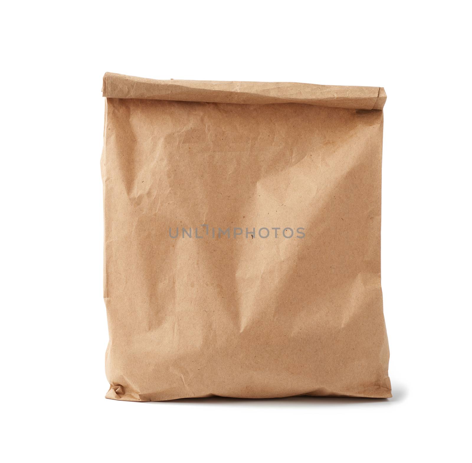 full paper disposable bag of brown kraft paper isolated on white background, concept of rejection of plastic packaging, template for designer, packaging for contactless product delivery
