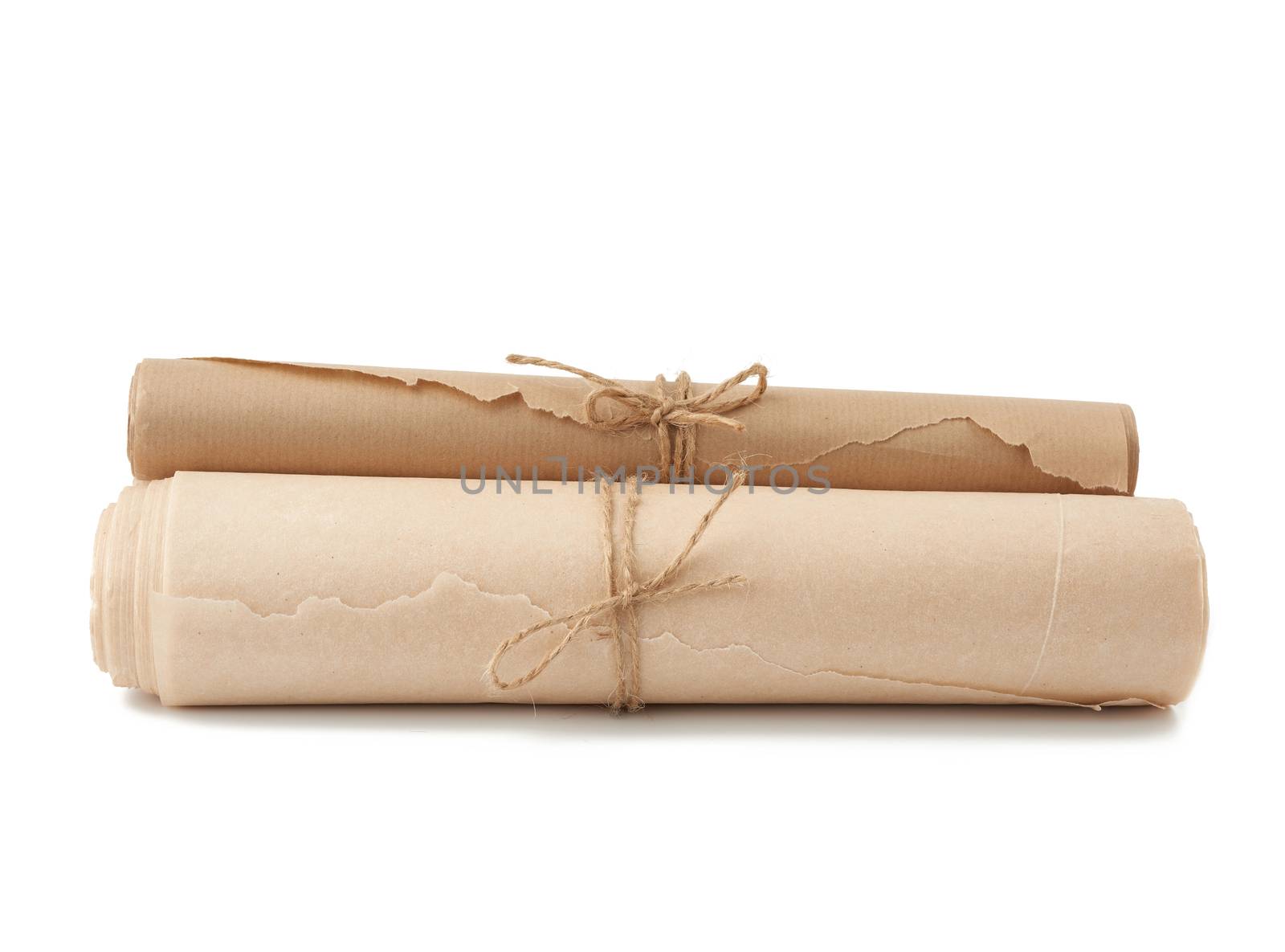 stack of twisted rolls of brown paper isolated on white backgrou by ndanko