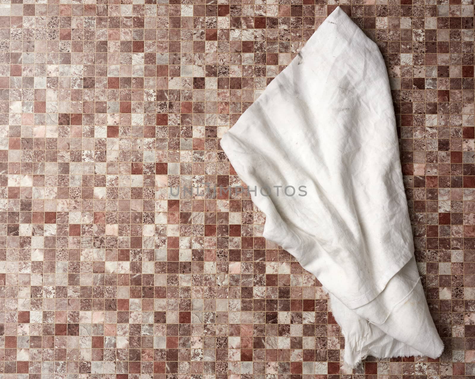 dirty white kitchen towel on a kitchen brown surface by ndanko