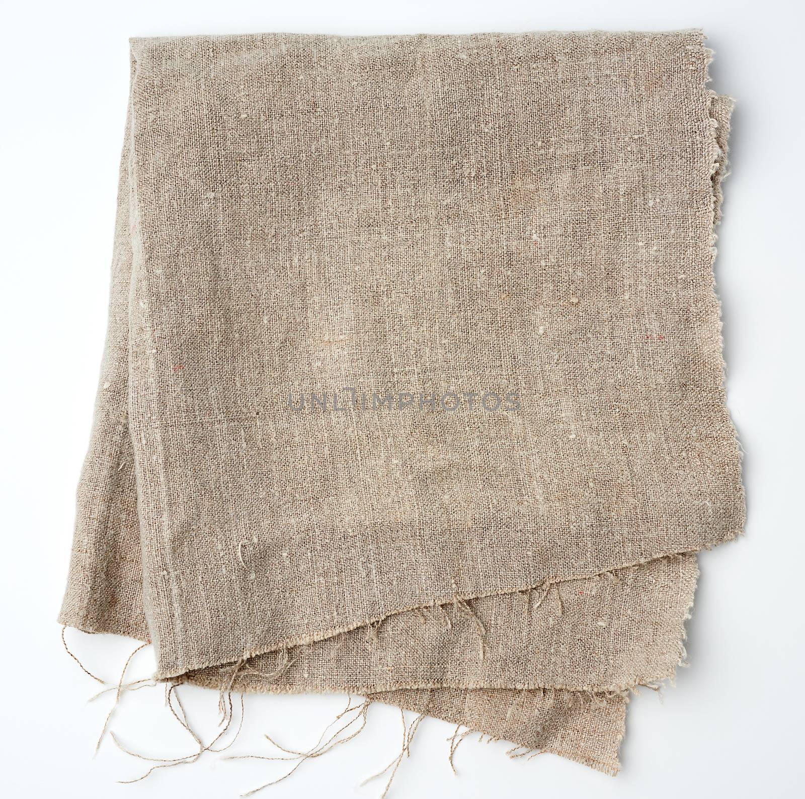 crumpled kitchen linen gray towel on white background, top view
