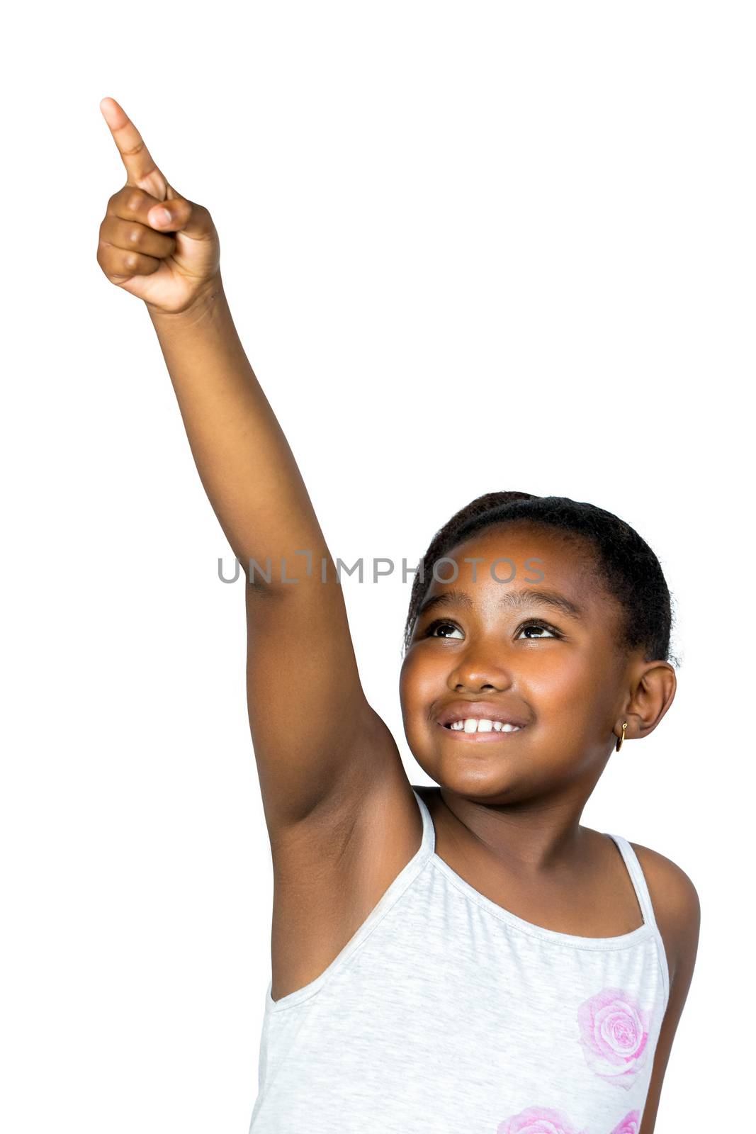 Close up portrait of cute little african girl with ponytail pointing with finger at corner.Isolated on white background.