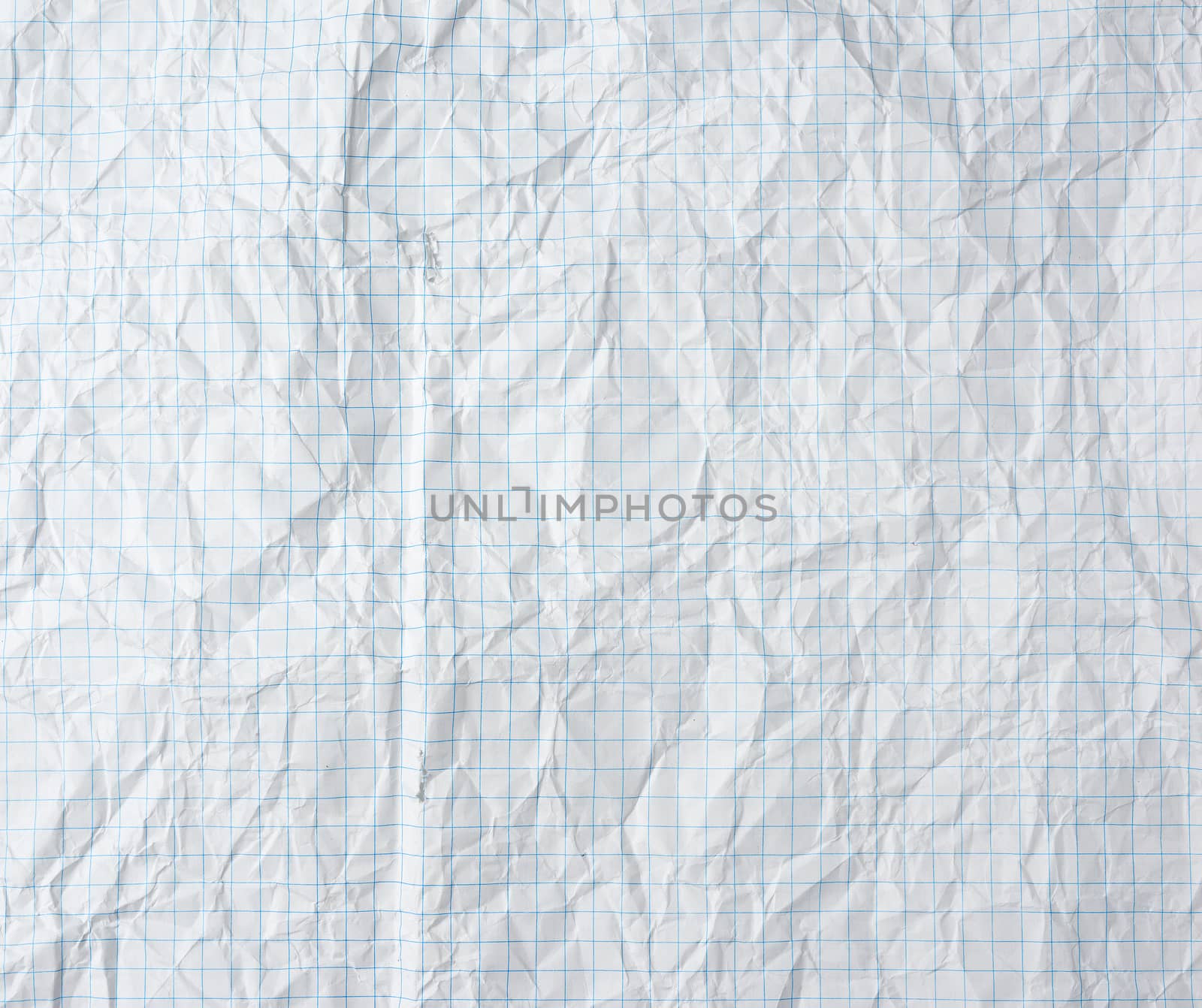 crumpled blank sheet of white paper in a cage from a school notebook, full frame 