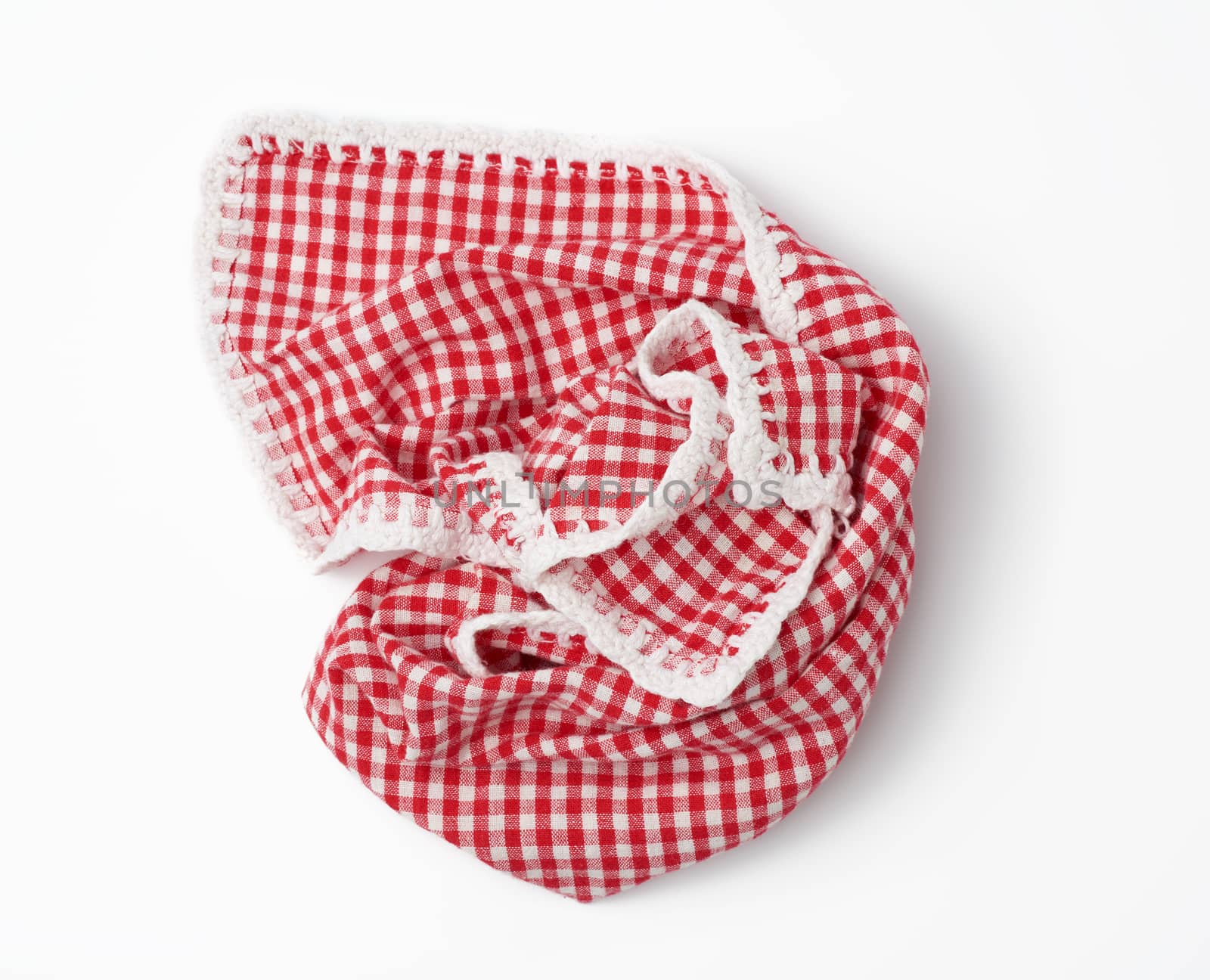crumpled kitchen red-white towel in on a white background by ndanko
