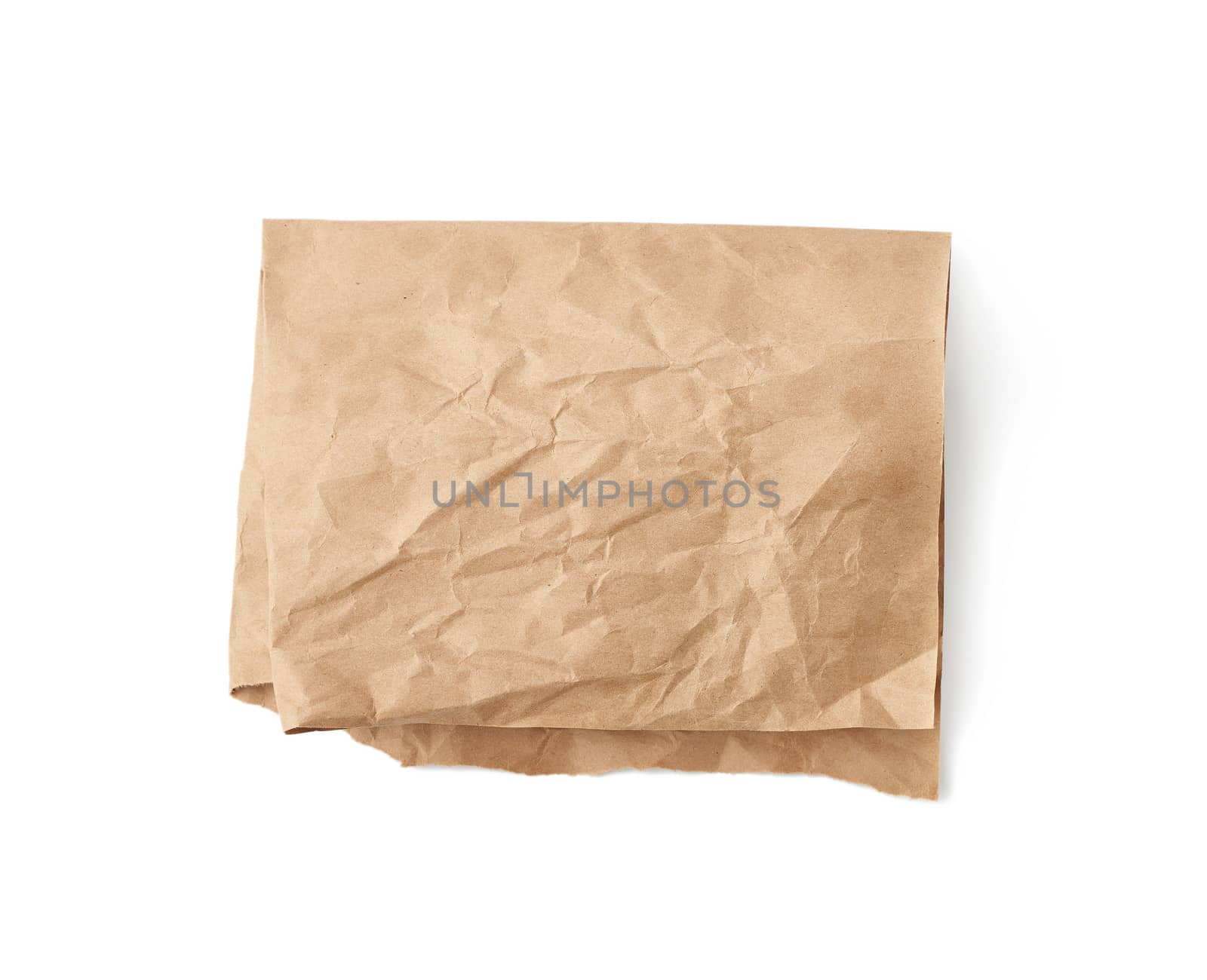 folded sheet of brown crumpled paper isolated on white backgroun by ndanko