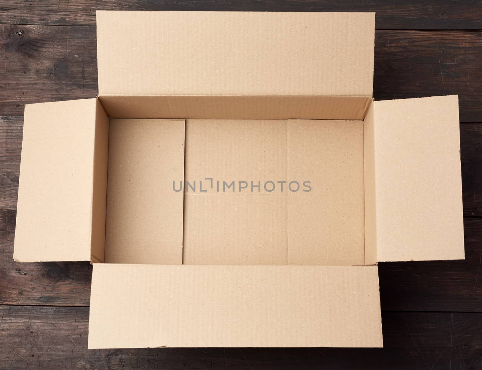 open  brown square cardboard box for transporting goods by ndanko