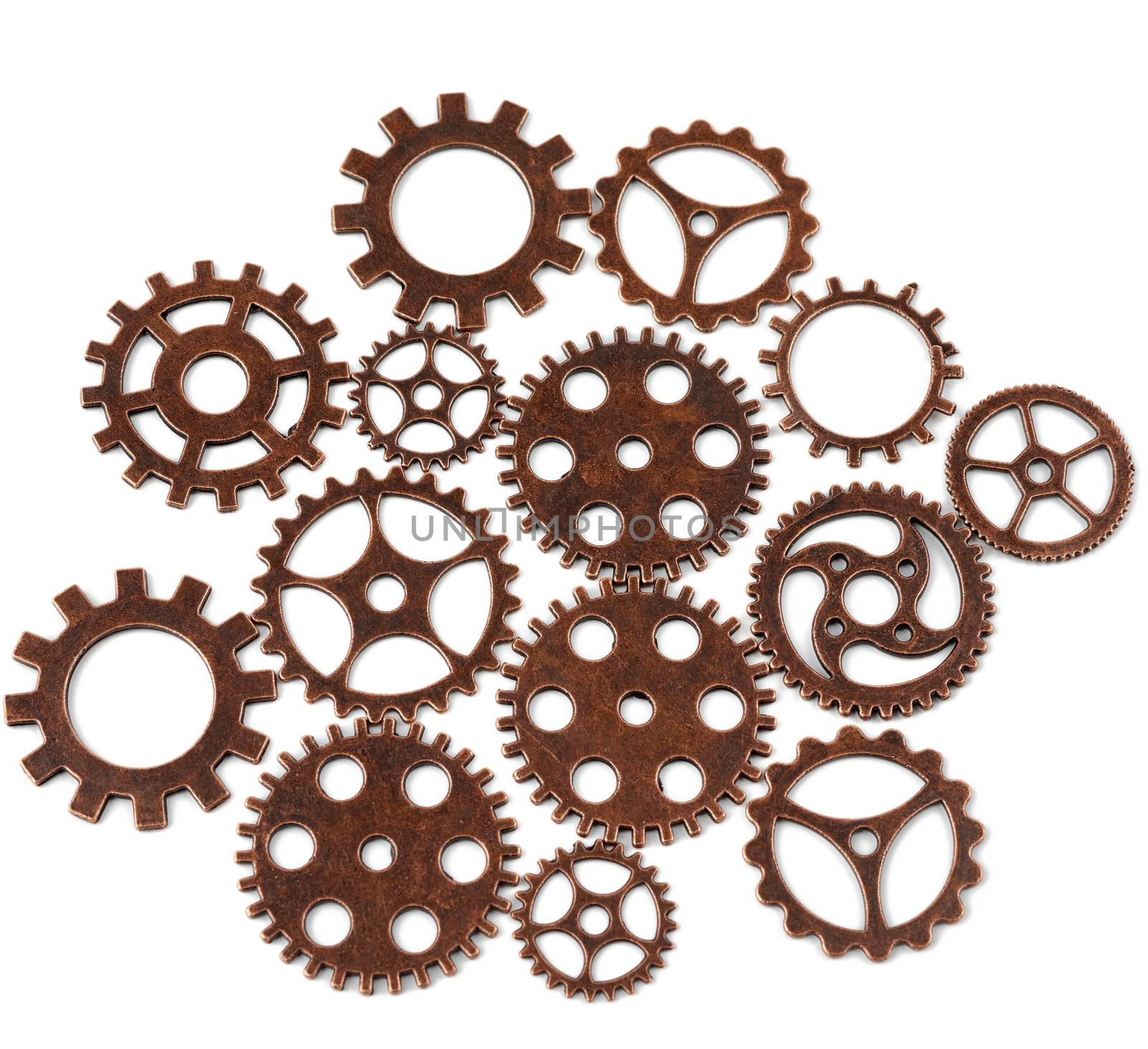 copper various cogs isolated on white background, close up