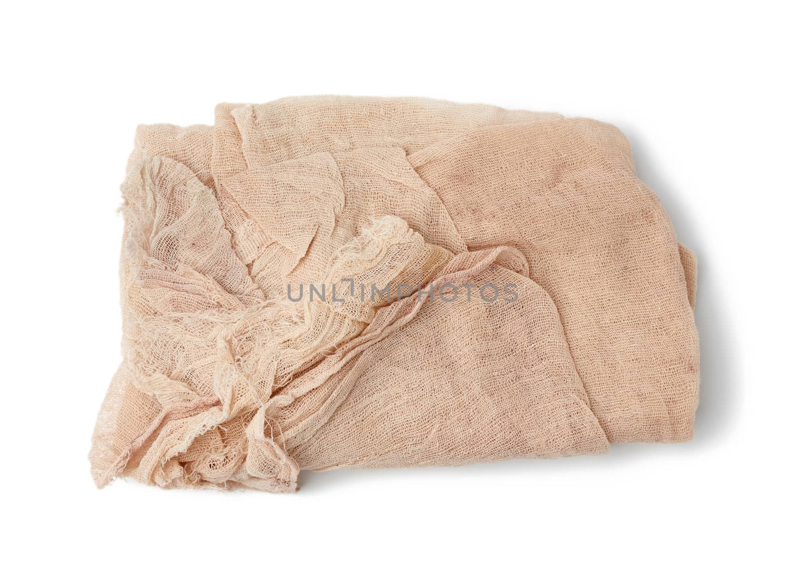 folded cotton beige gauze fabric isolated on white background, top view