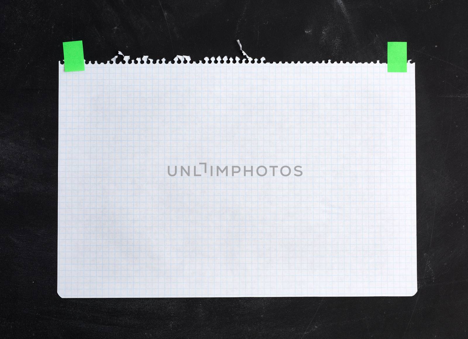blank white sheet of squared paper glued with velcro on a black  by ndanko
