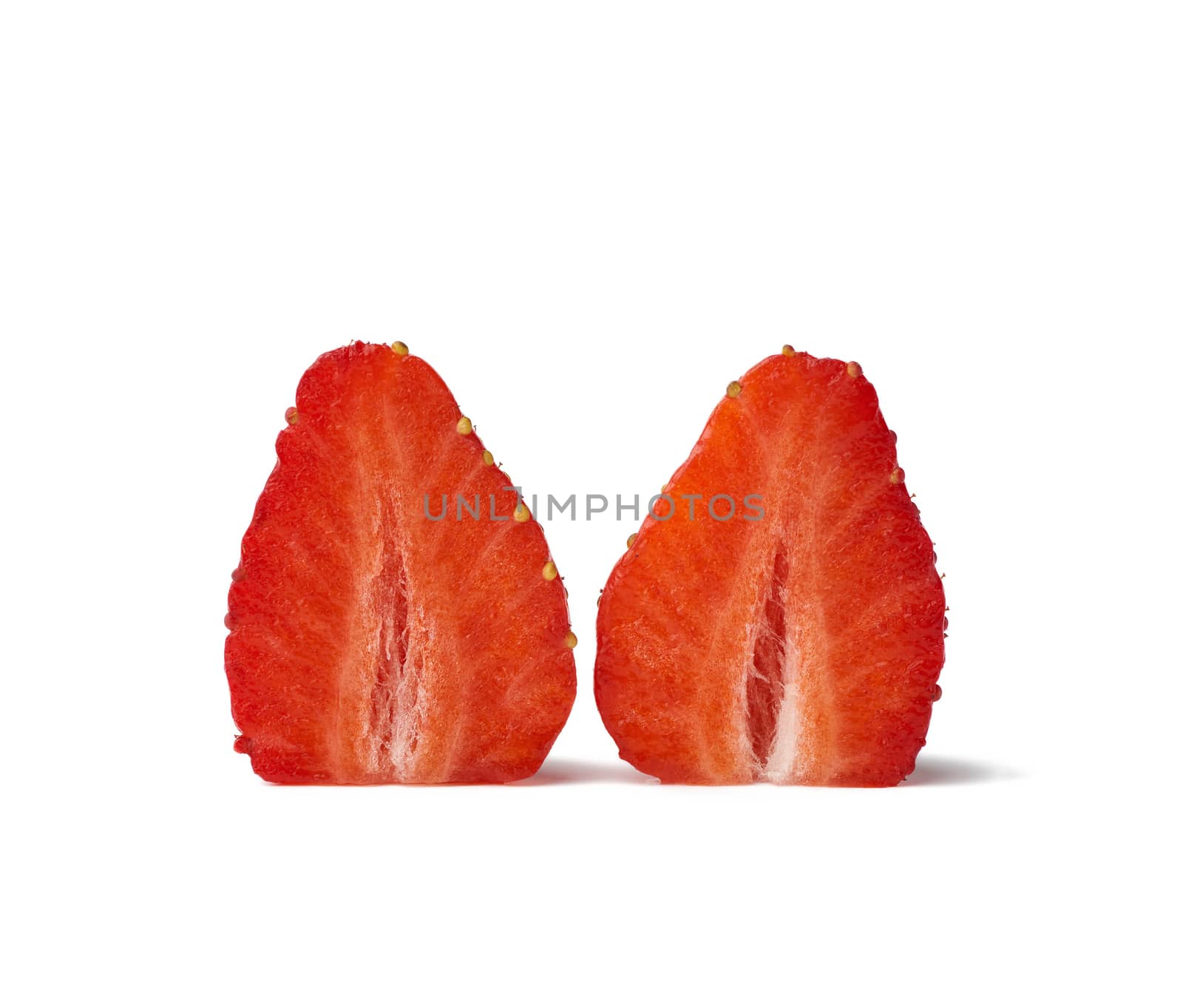 two halves of red ripe strawberries isolated on a white background, ripe fruit
