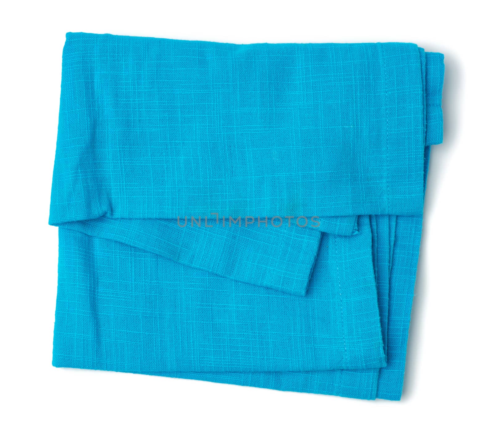 folded blue cotton fabric isolated on white background by ndanko