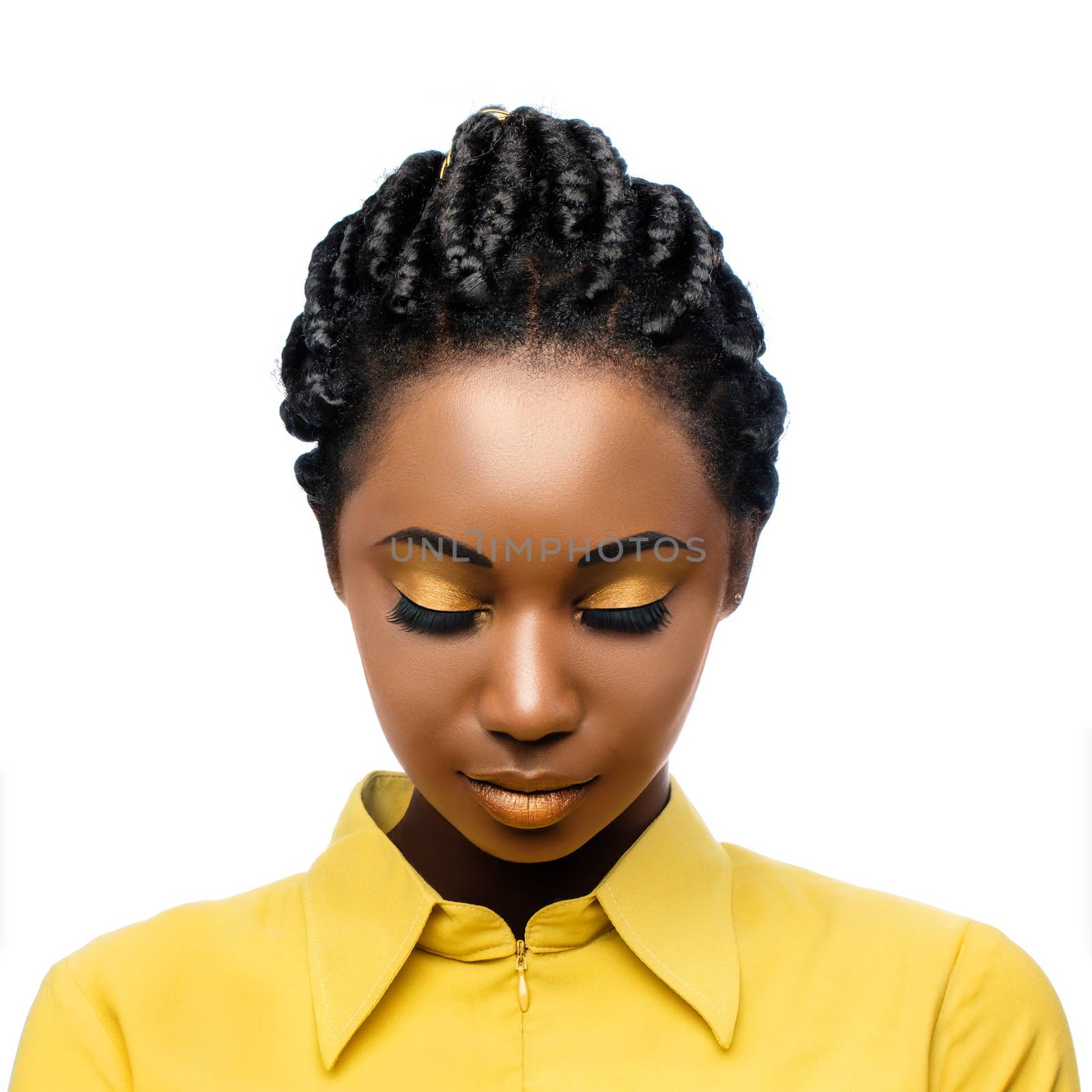 Macro close up beauty portrait of black woman looking down with eyes closed.Girl with stylish braided hairstyle and professional make up isolated on white background.