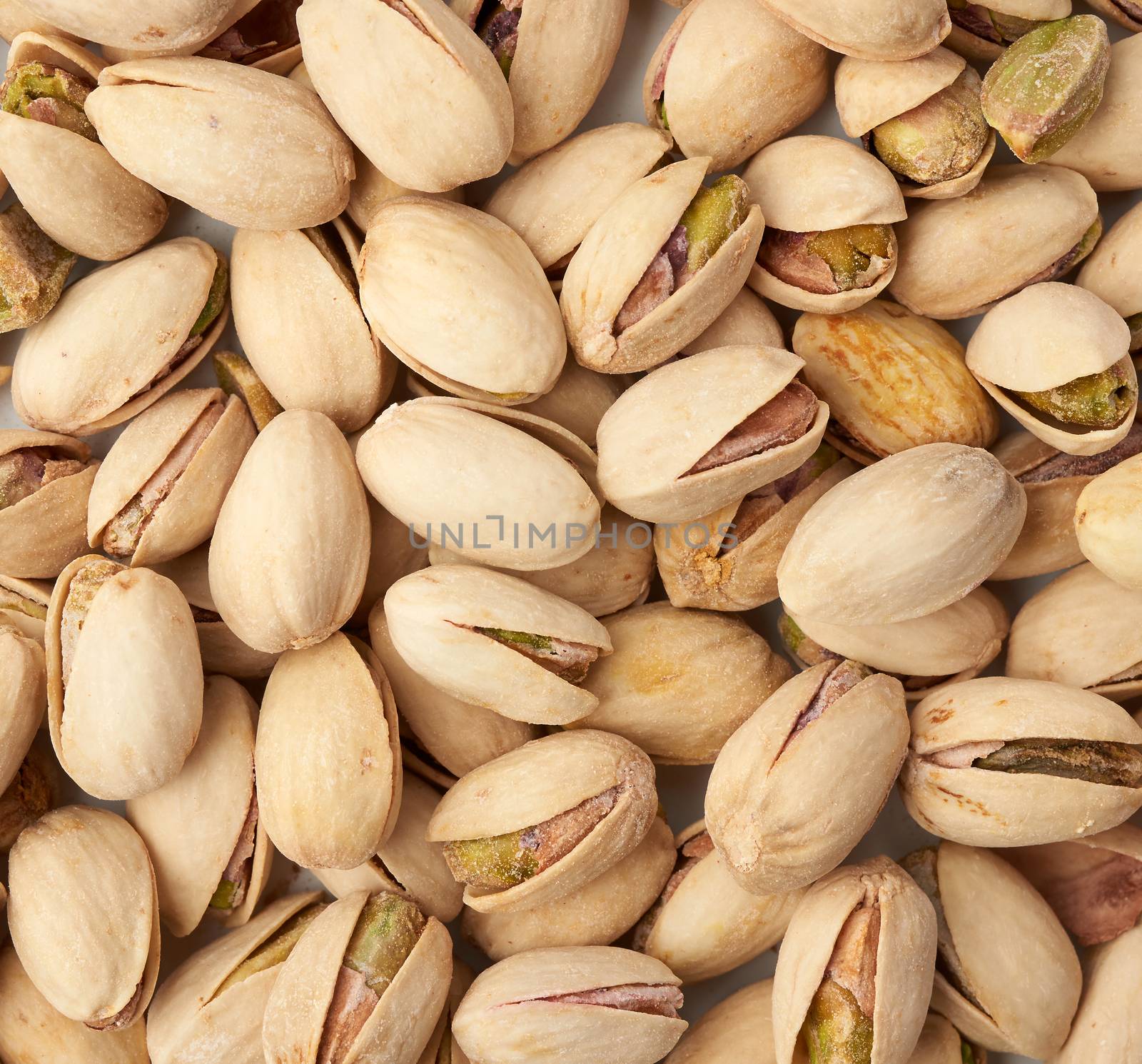 fried salted pistachios texture, top view. Roasted salted pistachio nuts