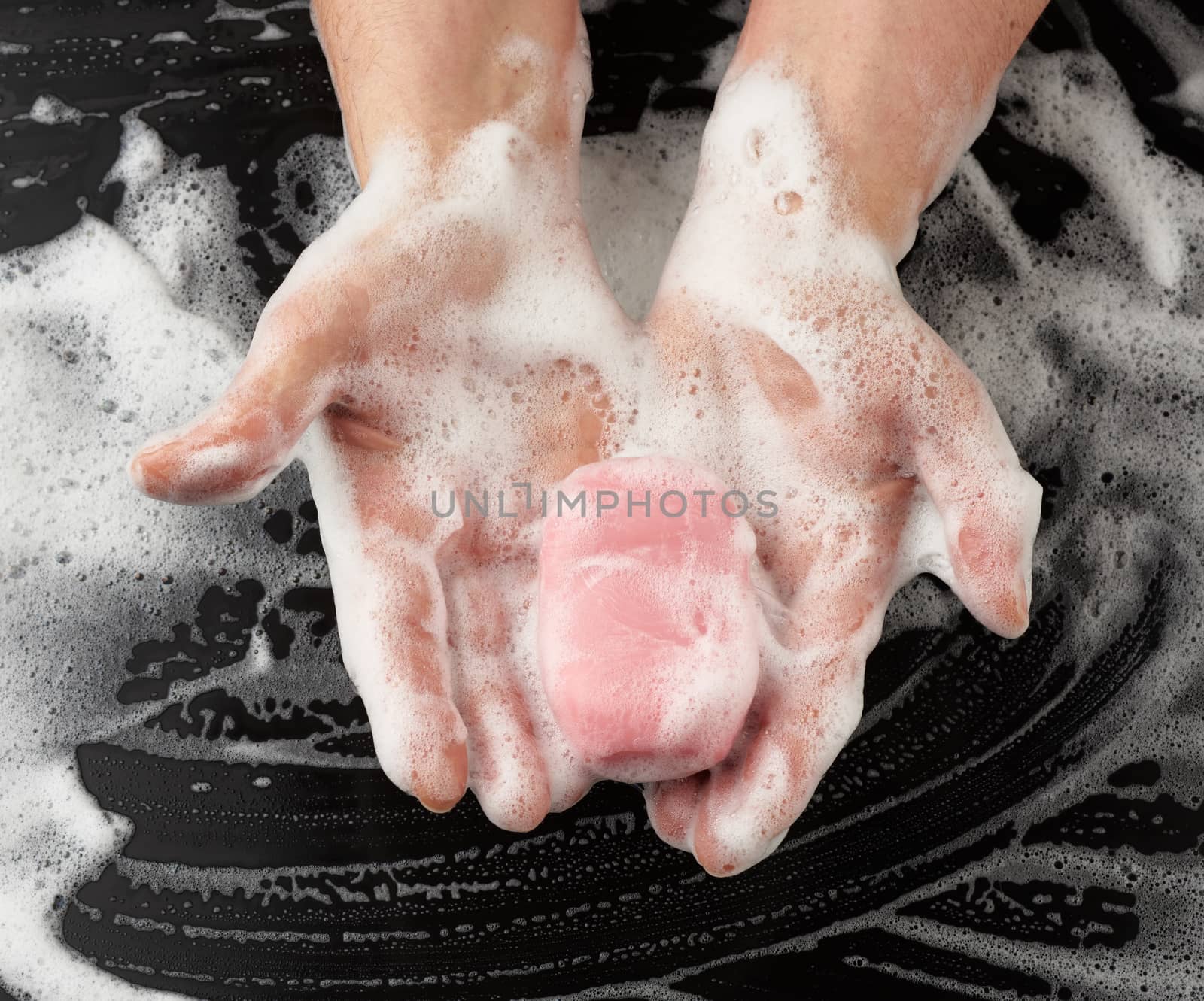 process of washing hands with pink soap, parts of the body in wh by ndanko
