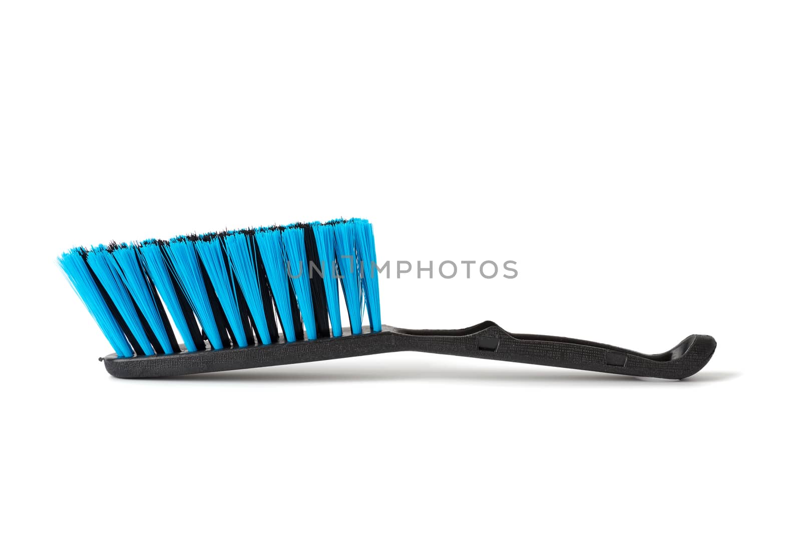 black plastic brush for cleaning the house isolated on a white background, close up