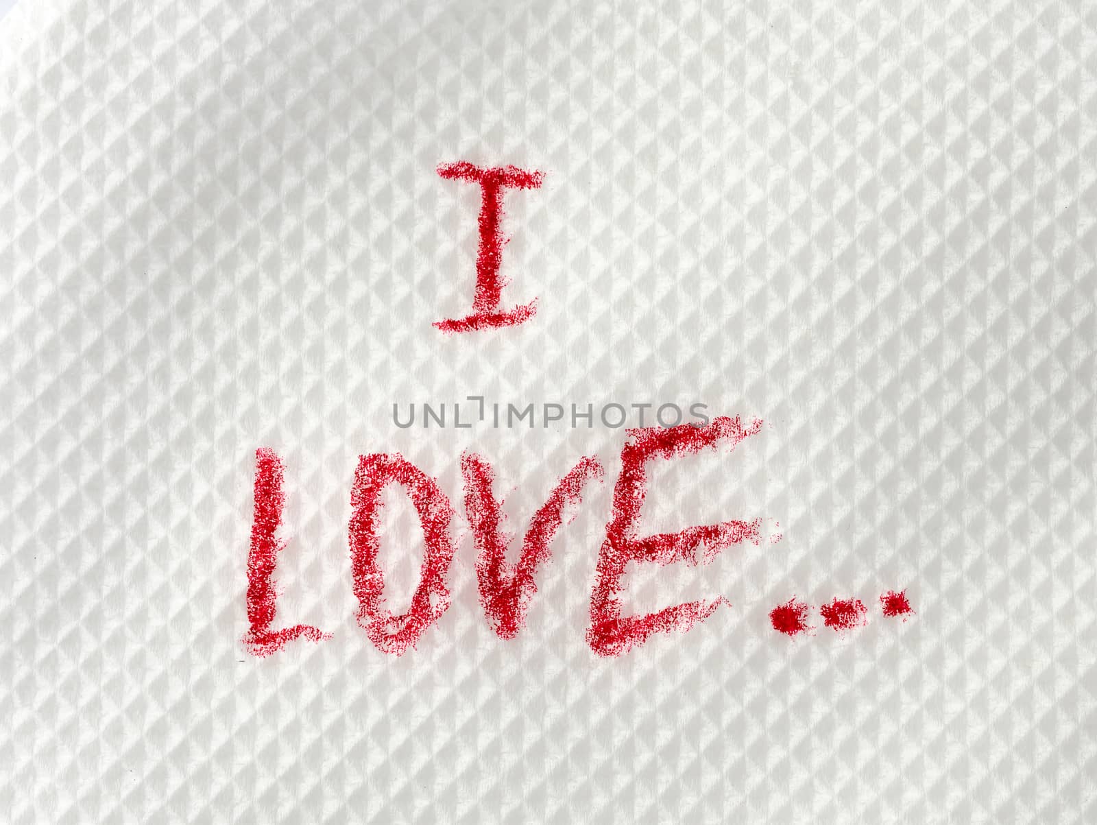 i love written in red lipstick on a white paper napkin, date concept