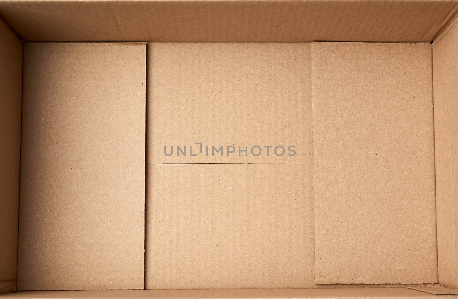 bottom of open empty brown cardboard box, top view by ndanko